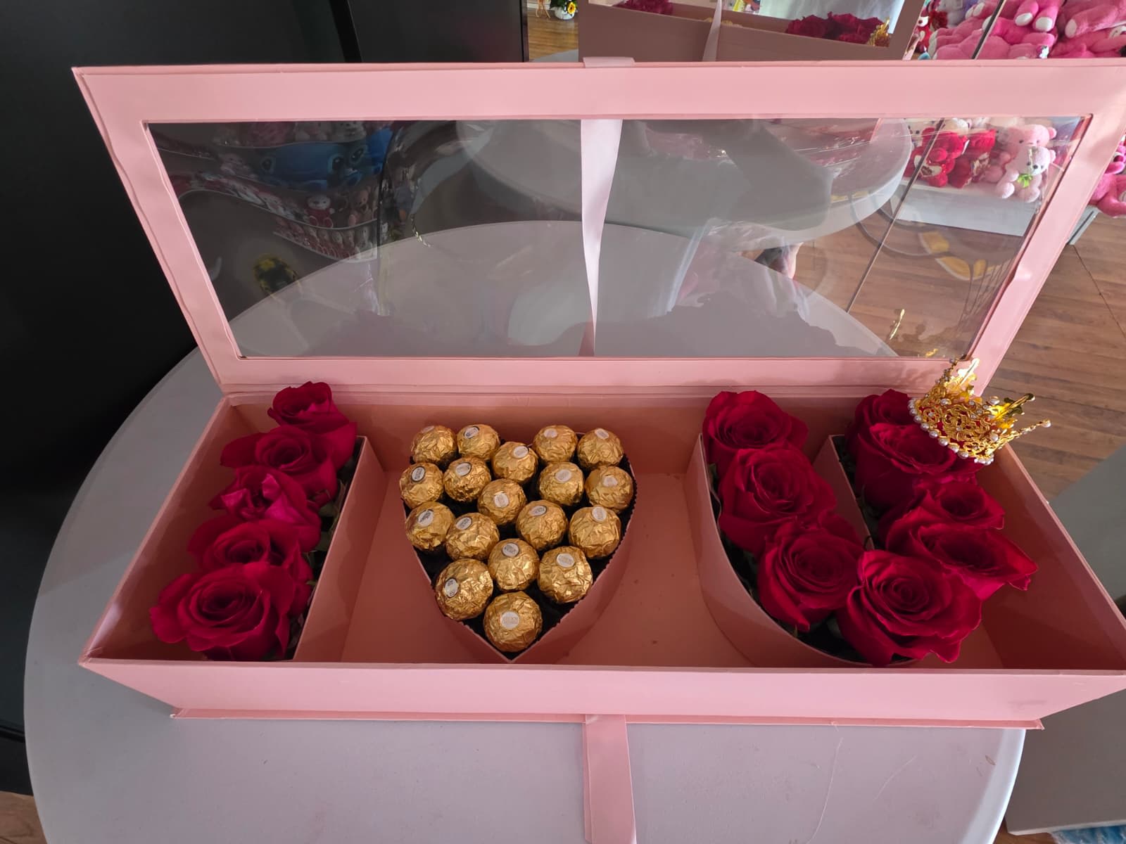 Pink gift box with red roses and Ferrero Rocher chocolates