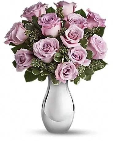 Roses and Moonlight Bouquet - This glorious bouquet features one dozen lush lavender roses in a sparkling Silver Reflections vase. Imagine how thrilled she'll be when this stunning gift arrives. She'll treasure the beautiful vase forever. The beautiful bouquet includes twelve lavender roses accented with assorted greenery.  