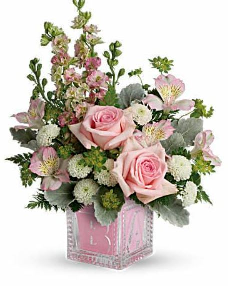 Bundle Of Joy Bouquet - Welcome the new addition with a charming glass baby block keepsake, bursting with a sweet pink bouquet of roses, mums and delphinium. Pink roses, pink alstroemeria, white cushion spray chrysanthemums, and pink larkspur are accented with bupleurum, dusty miller, leatherleaf fern. Delivered in an adorable Baby Block. 