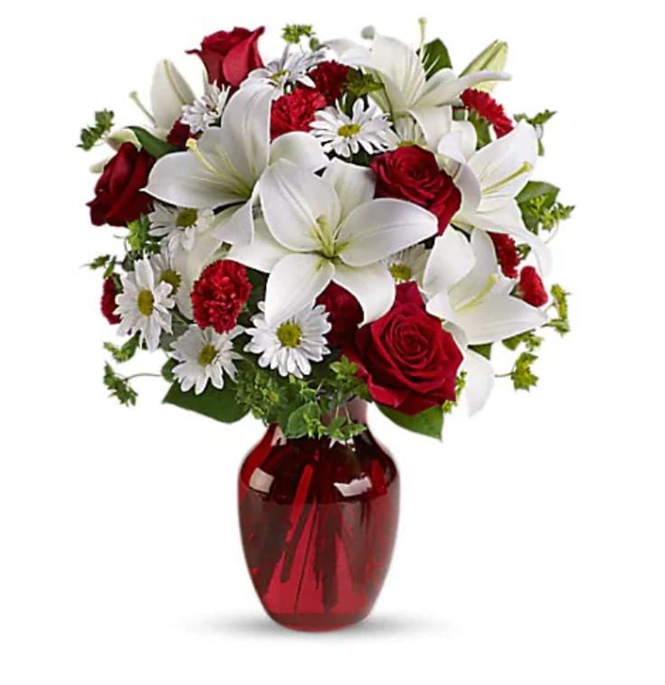 Be My Love Bouquet With Red Roses - The spirit of love and romance is beautifully captured in this enchanting bouquet. It's the perfect gift for anyone you love. Red roses and carnations are exquisitely arranged with white asiatic lilies and chrysanthemums in a ruby red glass vase.    Orientation : All-Around  