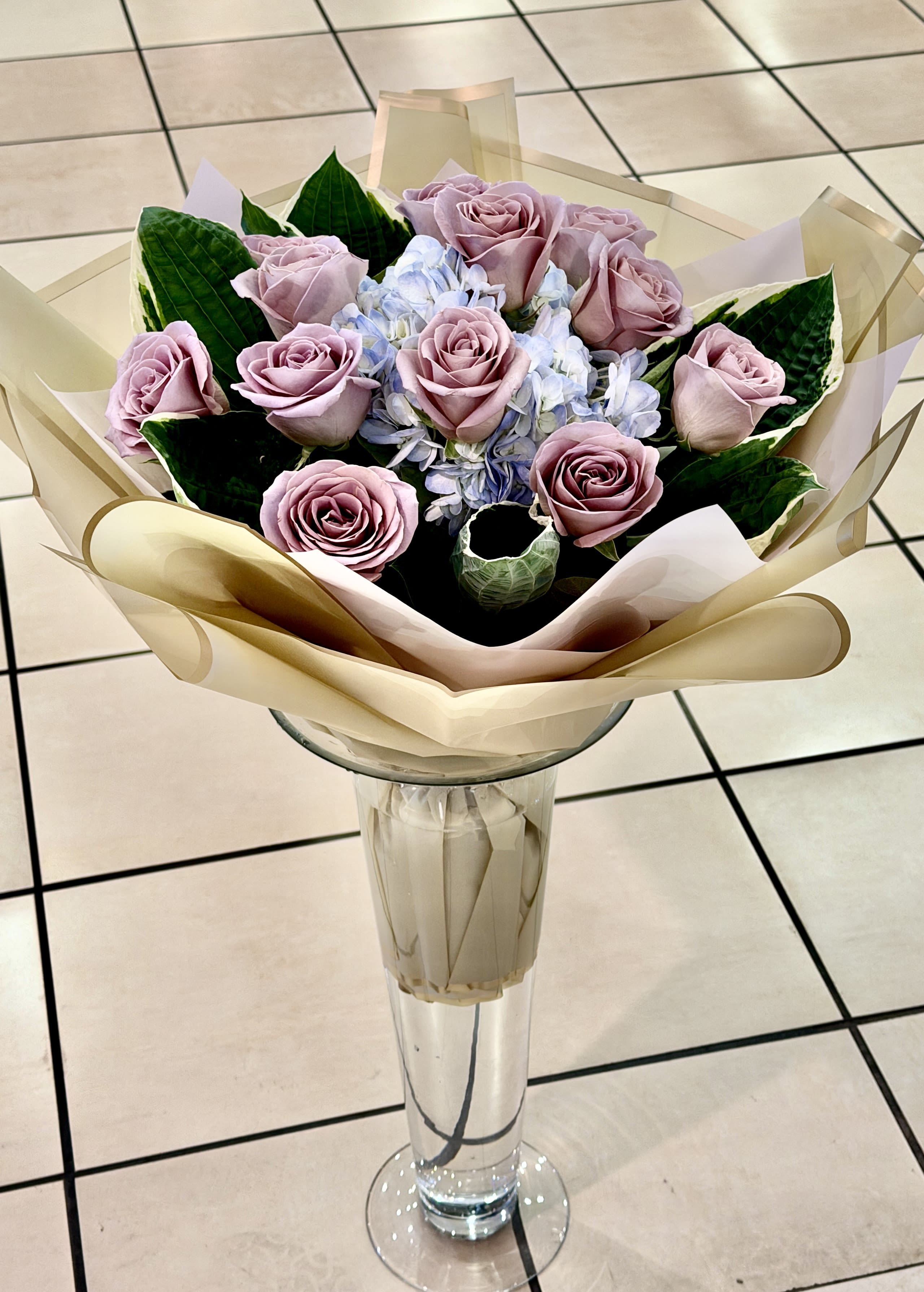 Ocean Shores - Angels Green flower shop Signature Wrap Bouquet.  Ocean Song Rose Wrap:   Standard 12 Roses Deluxe 18 Roses Premium 24 Roses