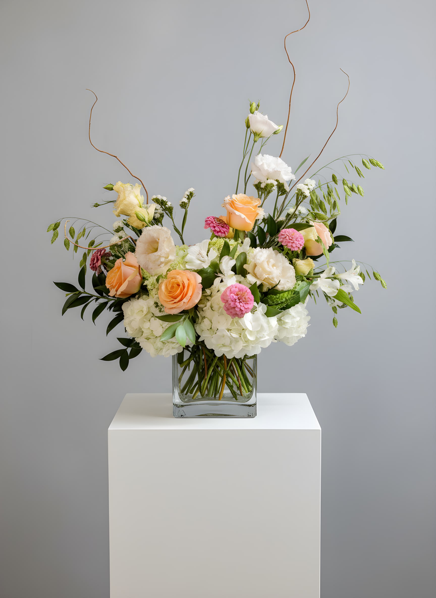 Elevated Love - Because flowers follow the rhythm of the seasons, availability changes often. Your arrangement may vary from the photo, and some varieties may differ. We design with the freshest blooms available, making substitutions when needed—while always preserving the overall mood: fresh, artful, and beautifully composed.  For specific flower or color requests, please contact us before ordering. 