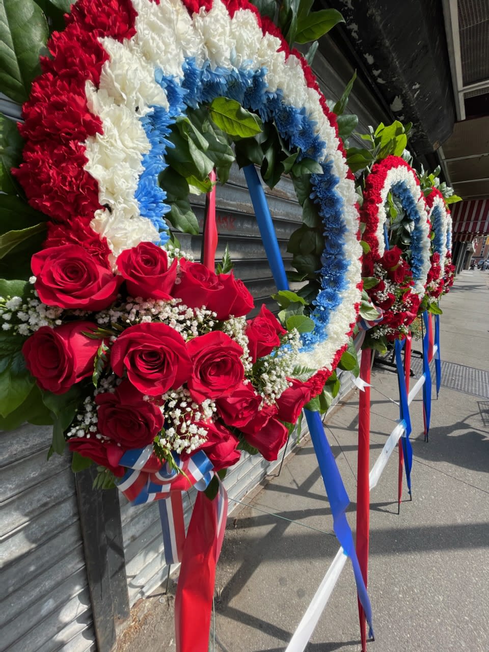 Patriotic Standing Sympathy Wreath  - Red, white and blue sympathy wreath with carnations and roses. Please not the price indicated is meant for one single spray.
