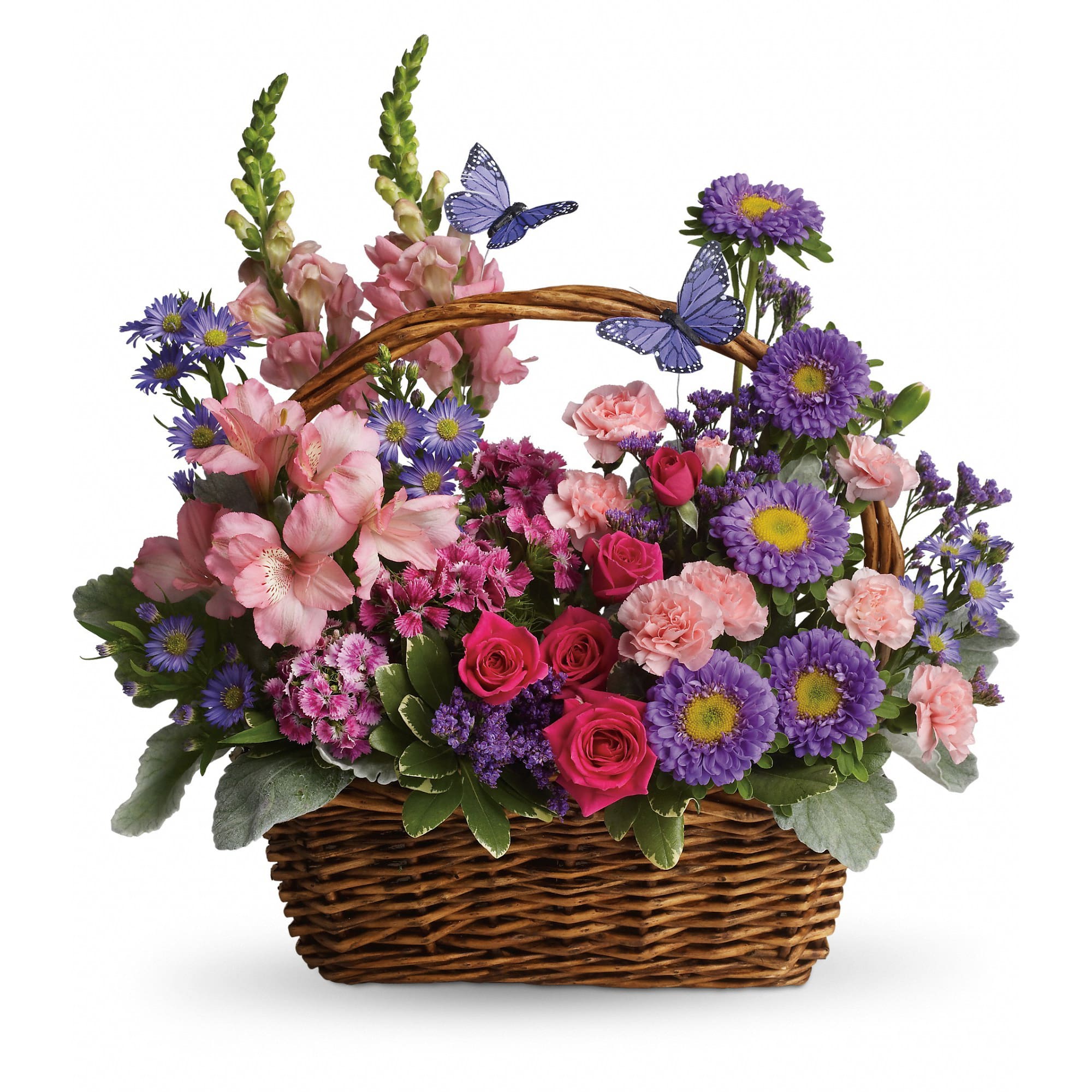 Basket arrangement of pink and purple flowers with butterfly picks