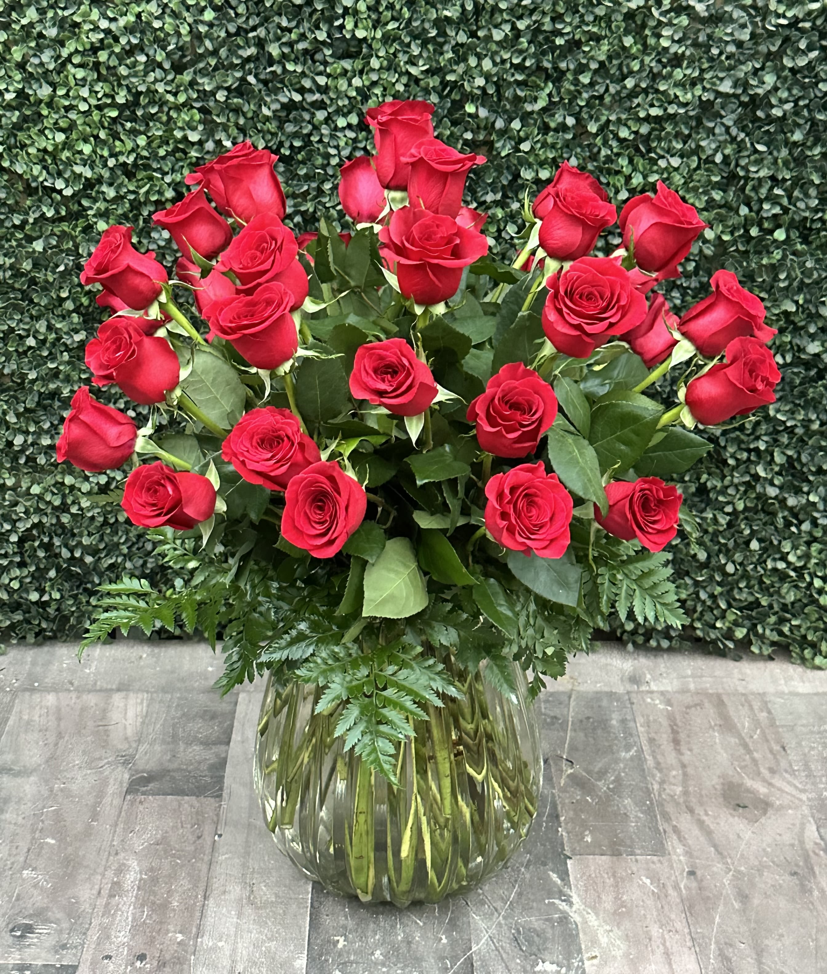Bouquet of red roses in a clear glass vase