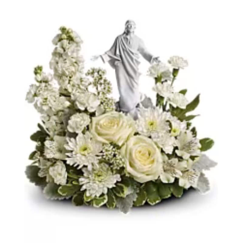 FOREVER FAITHFUL BOUQUET - An elegant display of faith and grace, this beautiful arrangement will comfort the bereaved in a truly thoughtful and respectful way. An exquisite sculpture of Jesus is surrounded by a bed of lovely blossoms. It is sure to be appreciated and always remembered. A fragrant mix of pure white blooms - including roses, alstroemeria, carnations. Delivered with an exclusive Sacred Grace keepsake. Orientation: One-Sided