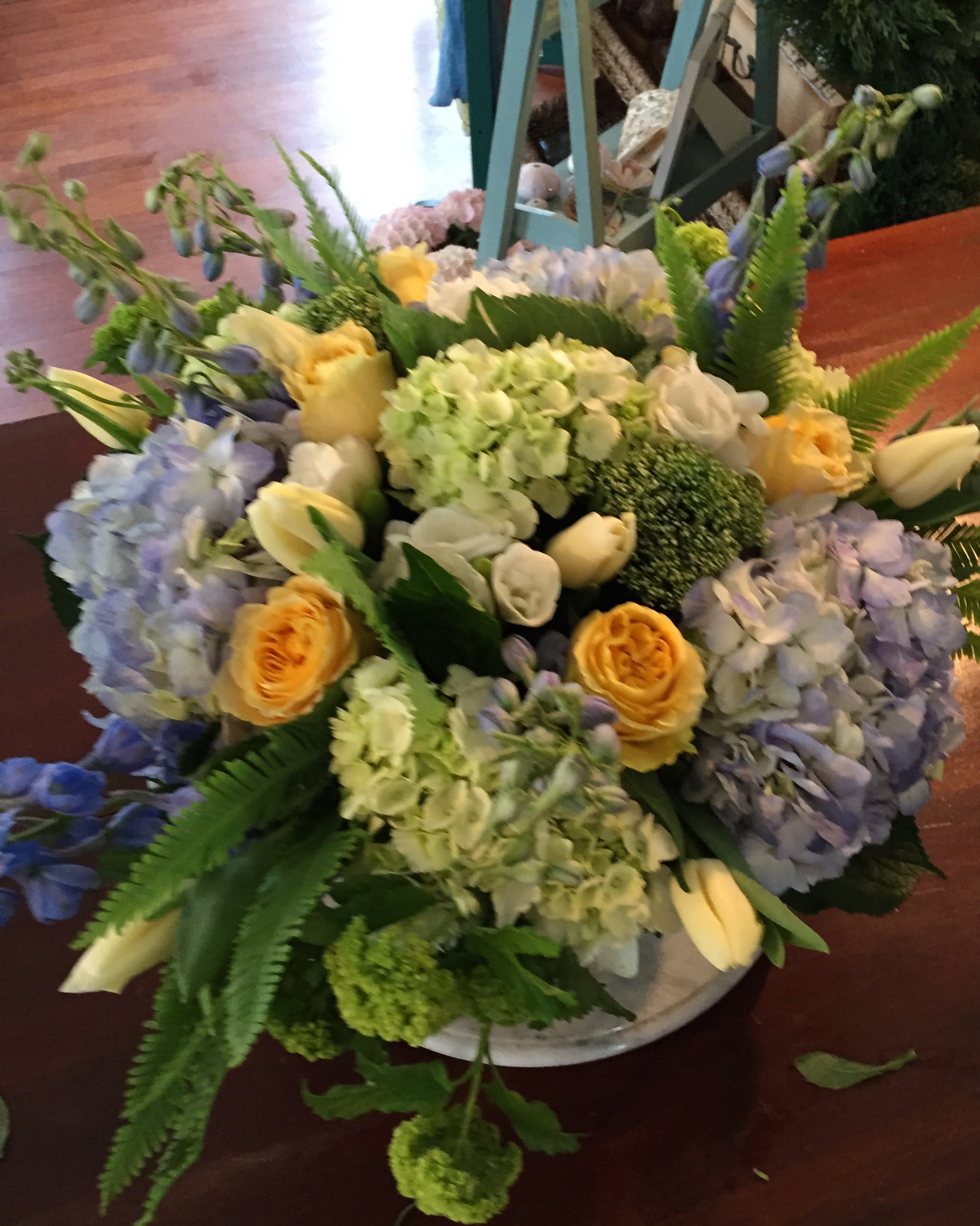 Blue Skies - Blue &amp; Green Hydrangea, Yellow roses, tulips, delphinium, freesia, viburnum