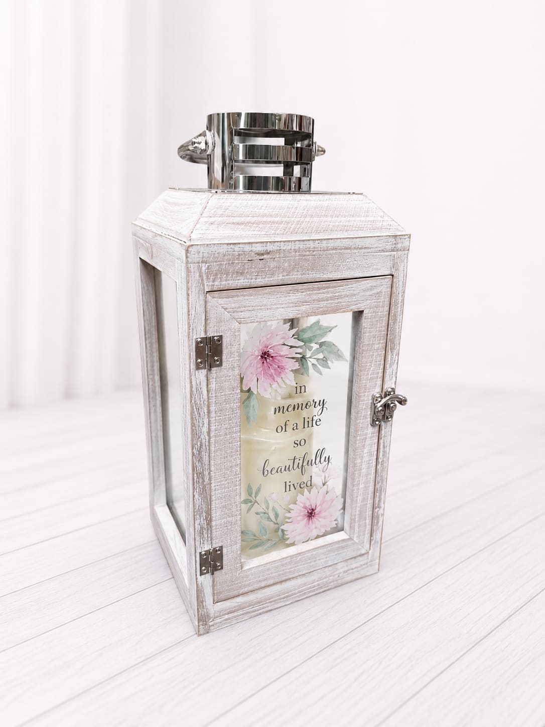Memorial Lantern - This Memorial Lantern is a timeless sympathy keepsake designed to honor and remember a cherished loved one. Featuring a warm LED candlelight, and the heartfelt sentiment. This rustic whitewashed lantern offers comfort, peace, and a gentle reminder of lasting love. A meaningful addition to memorial services, sympathy gifts, or home remembrance décor.