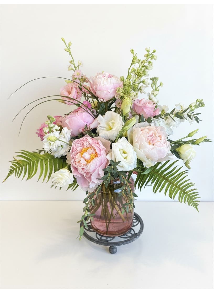 Peony Arrangement - We have peonies in stock, once they are gone, they are gone! Limited time only!  Soft pink peonies take center stage in this romantic flower arrangement, making it an ideal birthday bouquet or anniversary gift for someone who loves classic, feminine blooms. The composition reads like a fresh garden moment-pale white lisianthus and soft stock weave through the peonies, creating an airy, uplifted silhouette that feels both celebratory and refined.  