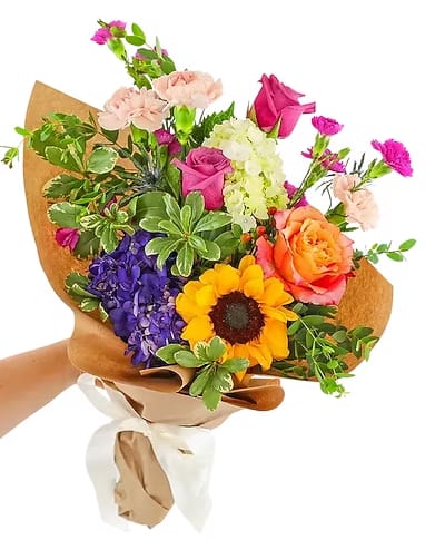 Designer Choice Graduation Hand wrapped bouquet - Not quite sure what to send? Let Yadilynn Flowers design a bouquet of the freshest, most beautiful seasonal flowers! The hand wrapped will be wrapped in a Korean wrapping paper. This bouquet is good for graduations, mother's day, birthday's,   Includes: • Seasonal Flowers • Personalized Card Message