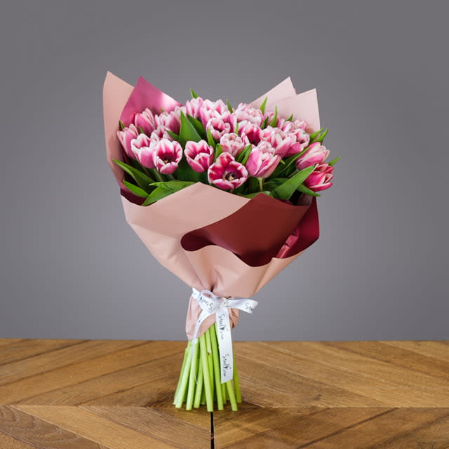 Tulip Wrap Bouquet  - Tulips blooming with love, beauty and joy. Hand tied bouquet of tulips wrap in a gorges paper. 
