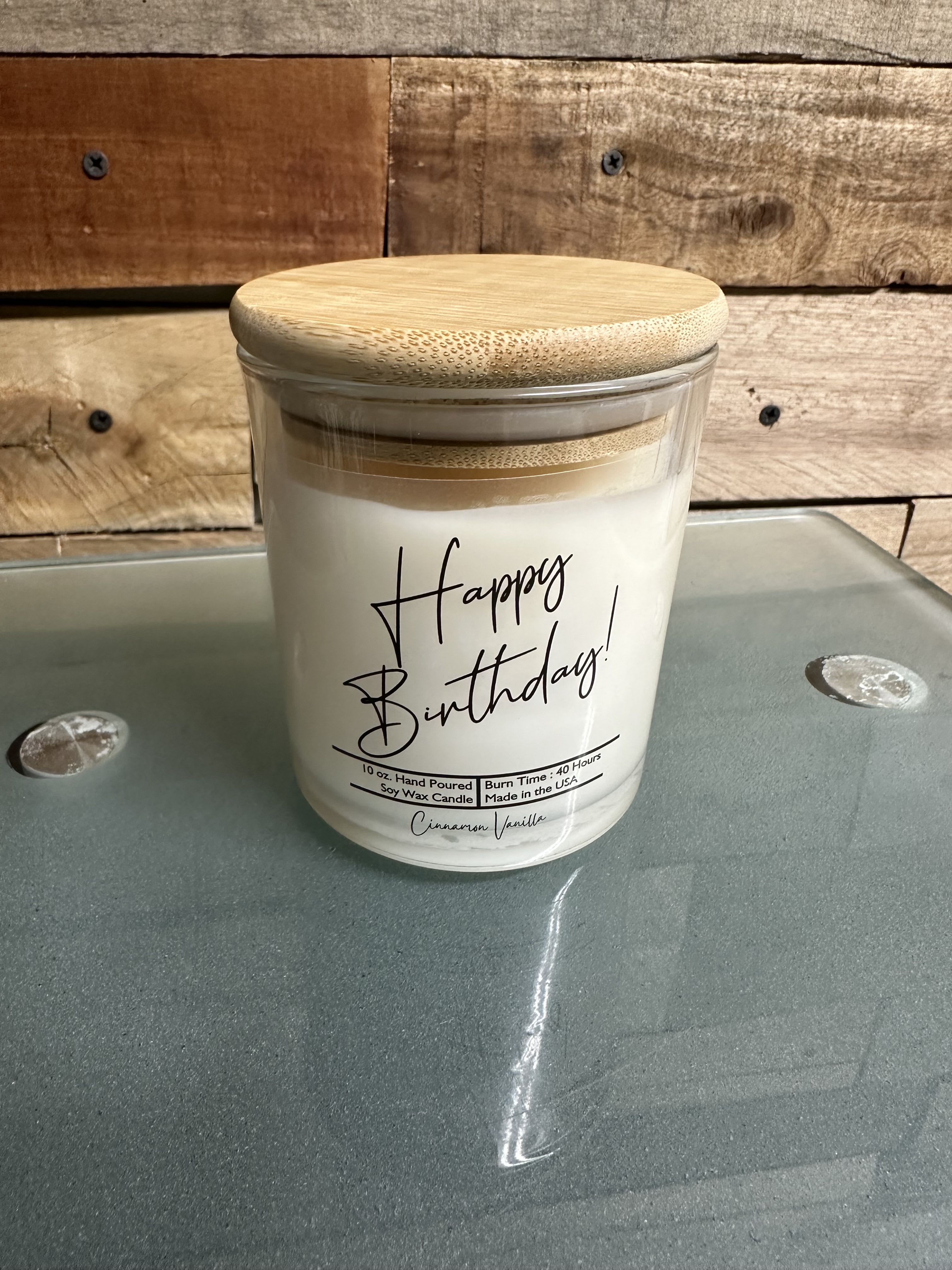 Birthday candle in a glass jar with a bamboo lid