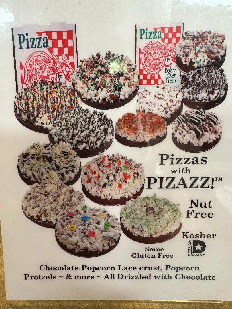 Poster showing assorted chocolate-drizzled popcorn pizzas in pizza boxes