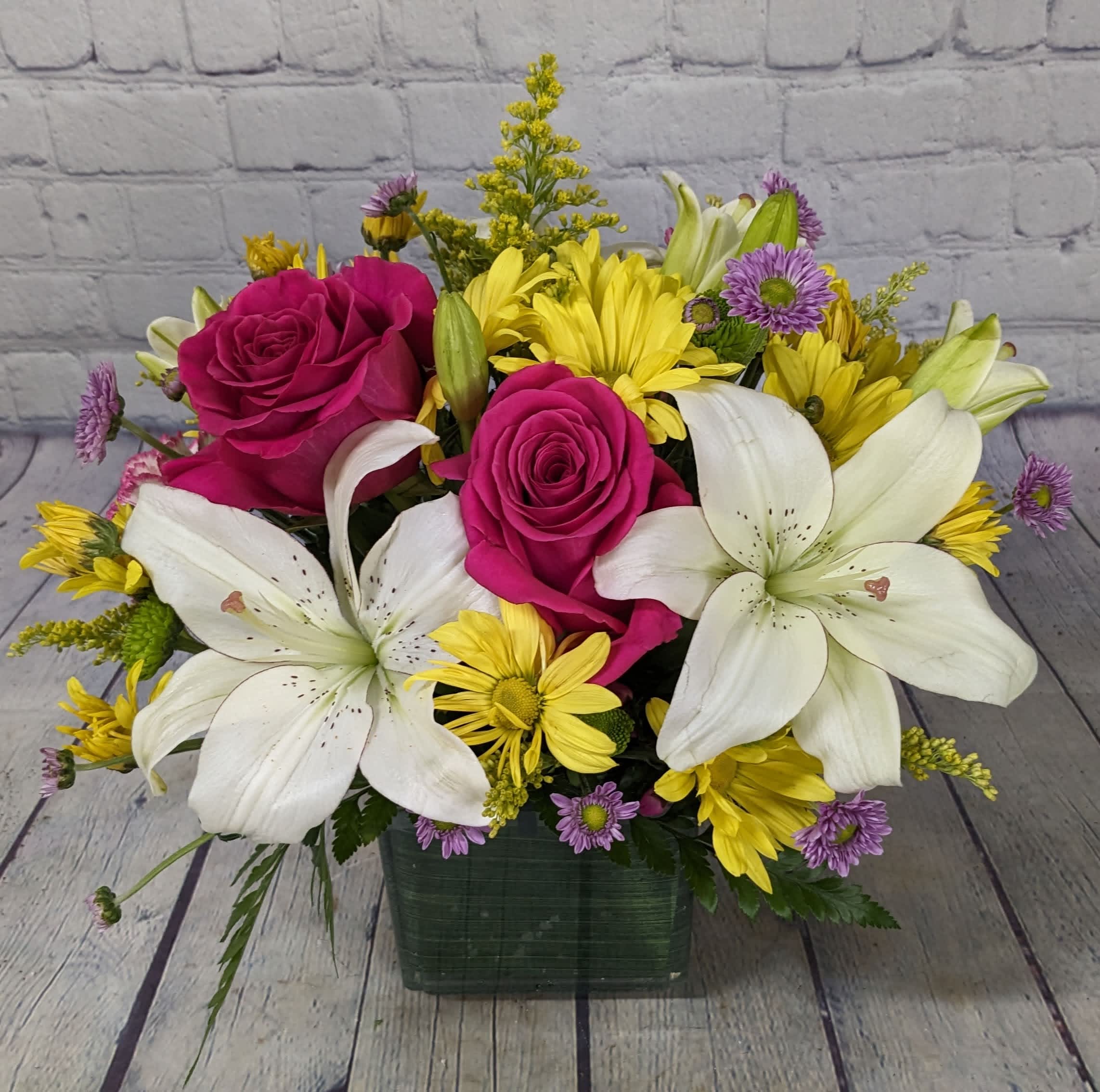 Watermelon Candy - A bright and sweet summer time bouquet to brighten up any day! Bouquet features; lilies, roses, daisies, micro daisies, &amp; solidago. 