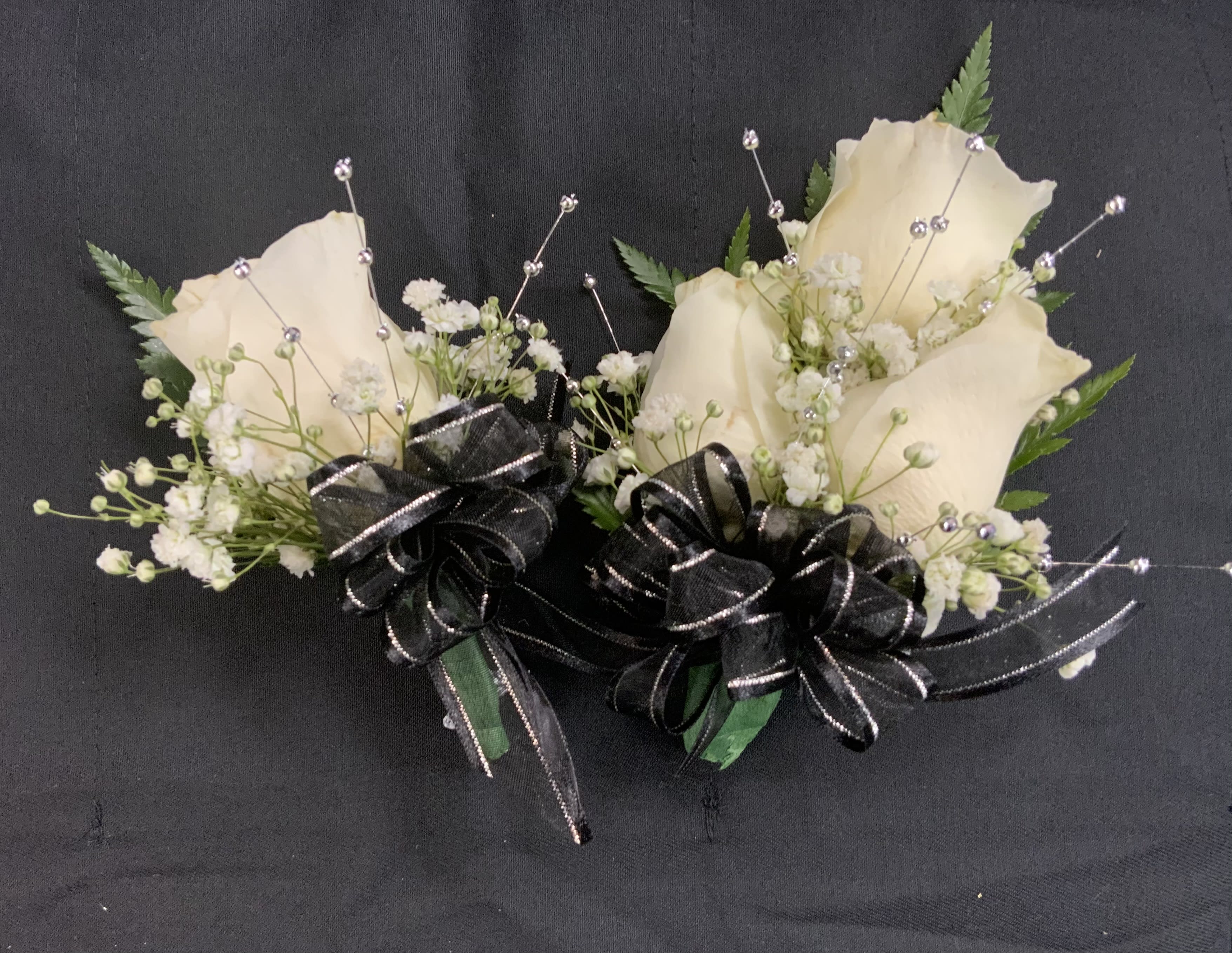 White Rose Corsage Set - It's Prom Season the perfect time to get Your Corsage. A Different Color Rose is available upon request. A Different Color Bow is available upon request. Beads available only in Gold, Silver or Pearls.