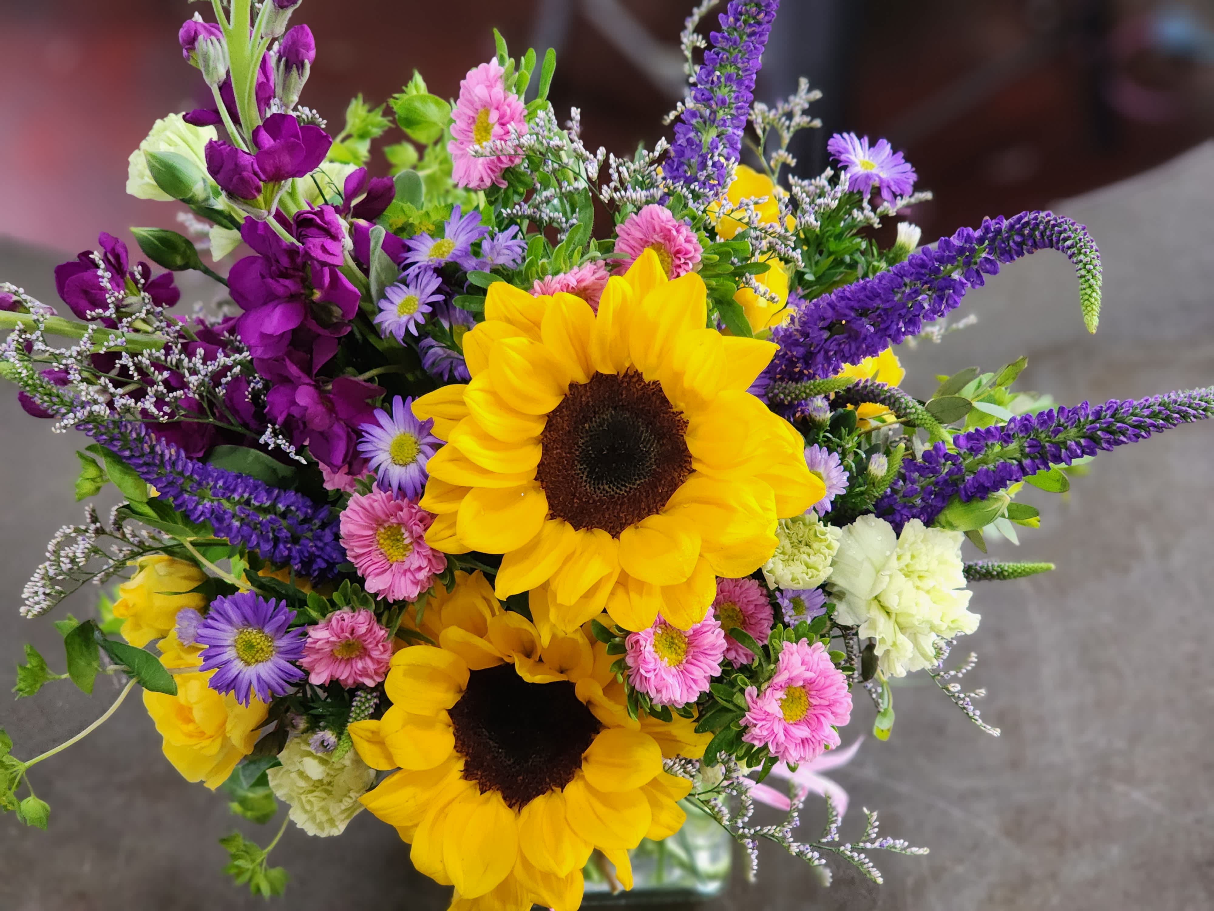 Bouquet with sunflowers, purple spikes, and pink and lavender daisies