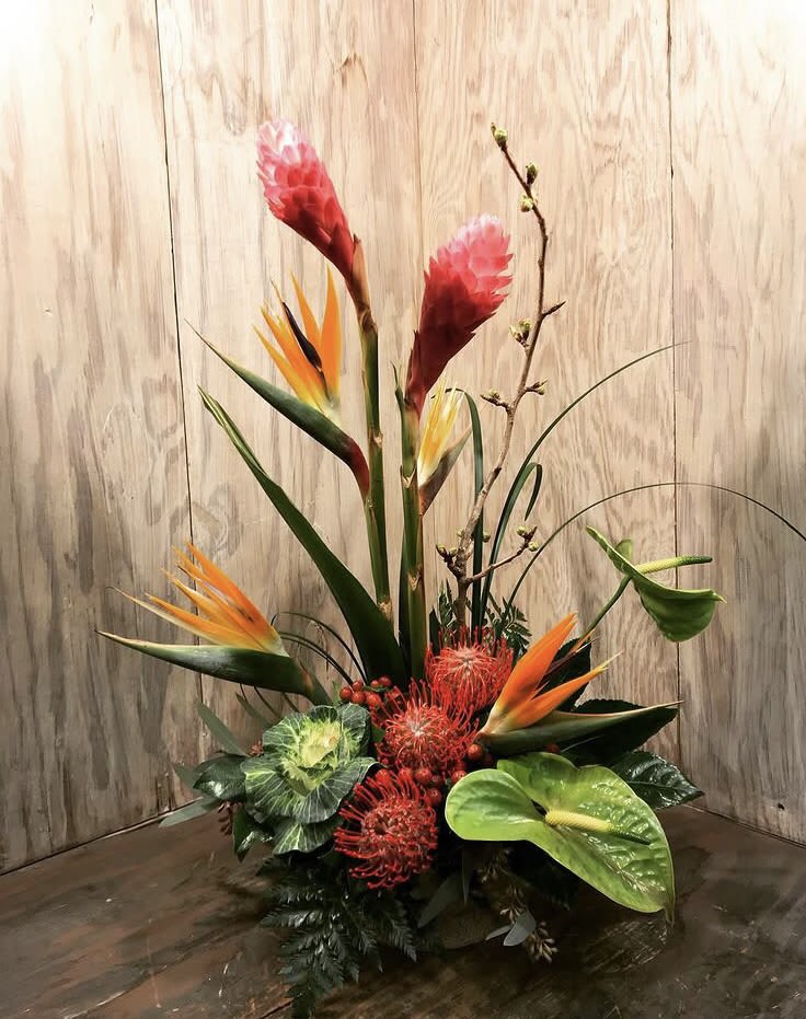 Tall tropical arrangement with bird of paradise, red protea, and anthurium