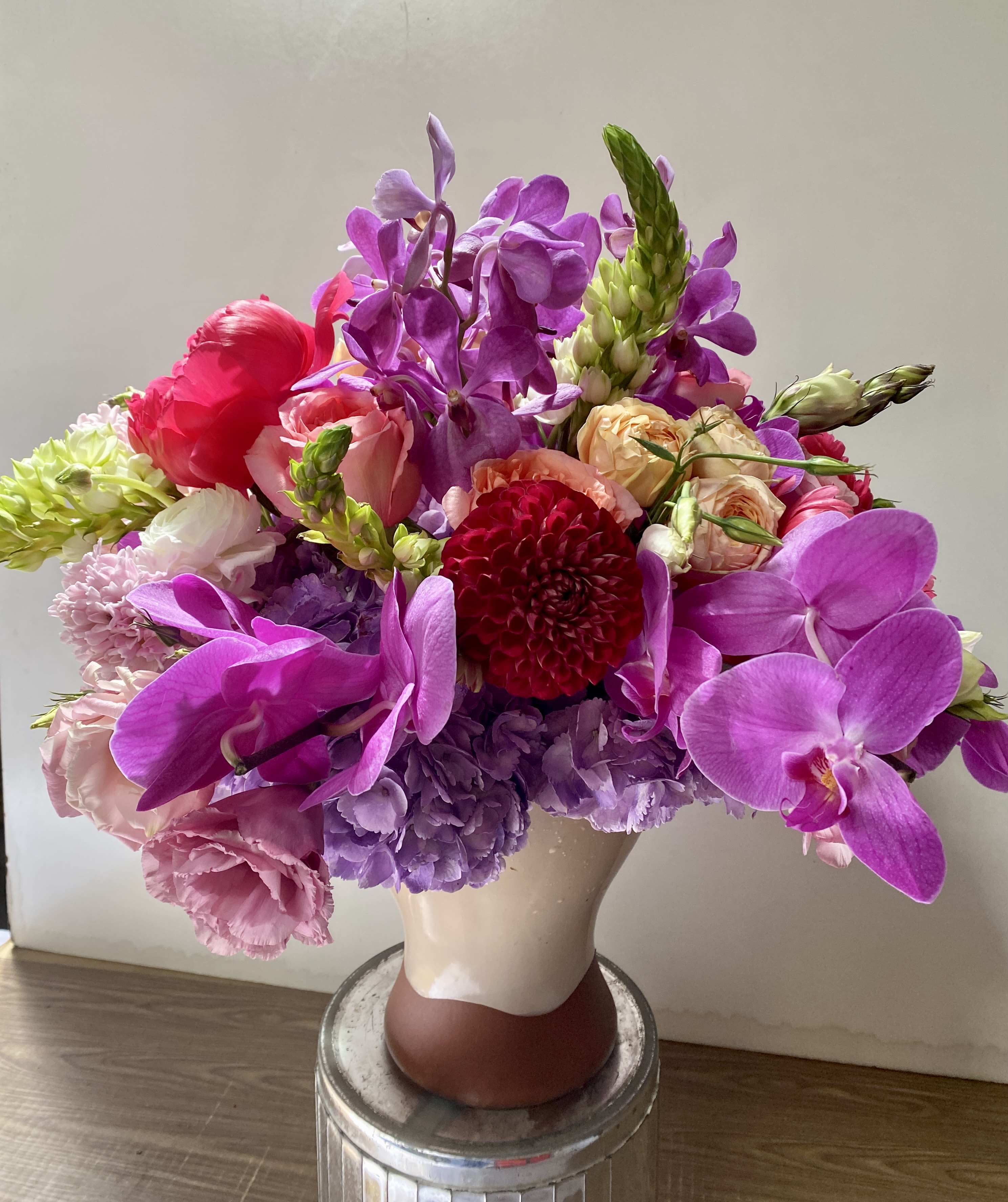 Funny Girl - In a beautiful pink ceramic vase combination off pink roses, green hydrangeas, peonies, tulips,  Campanula is arranged by Jane's Roses of San Francisco