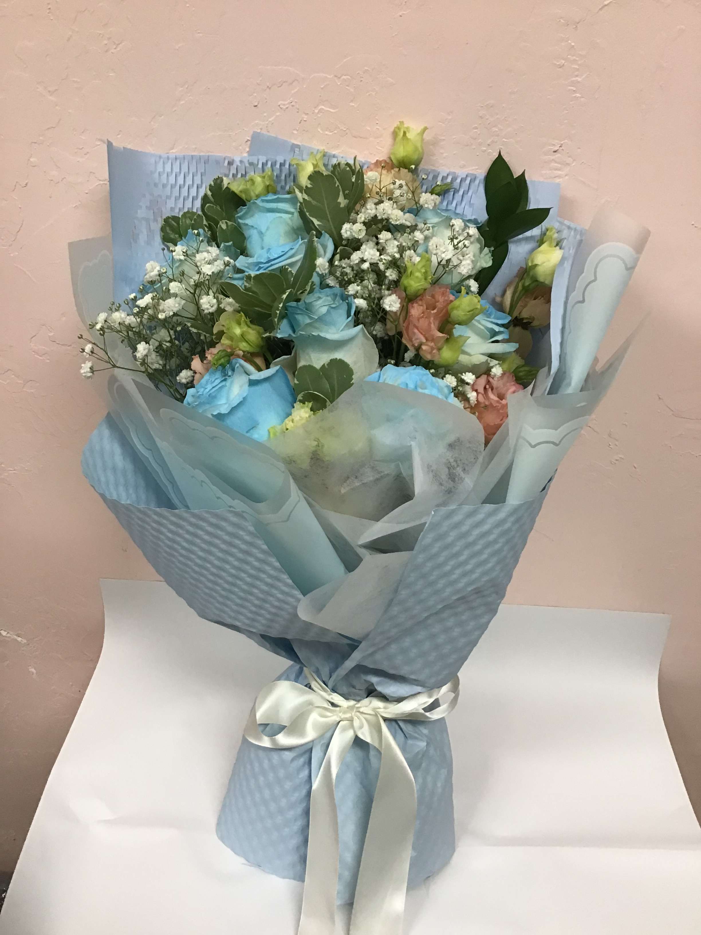 BQT42 - Light blue roses with white &amp; peach lisanthus and baby breathe 