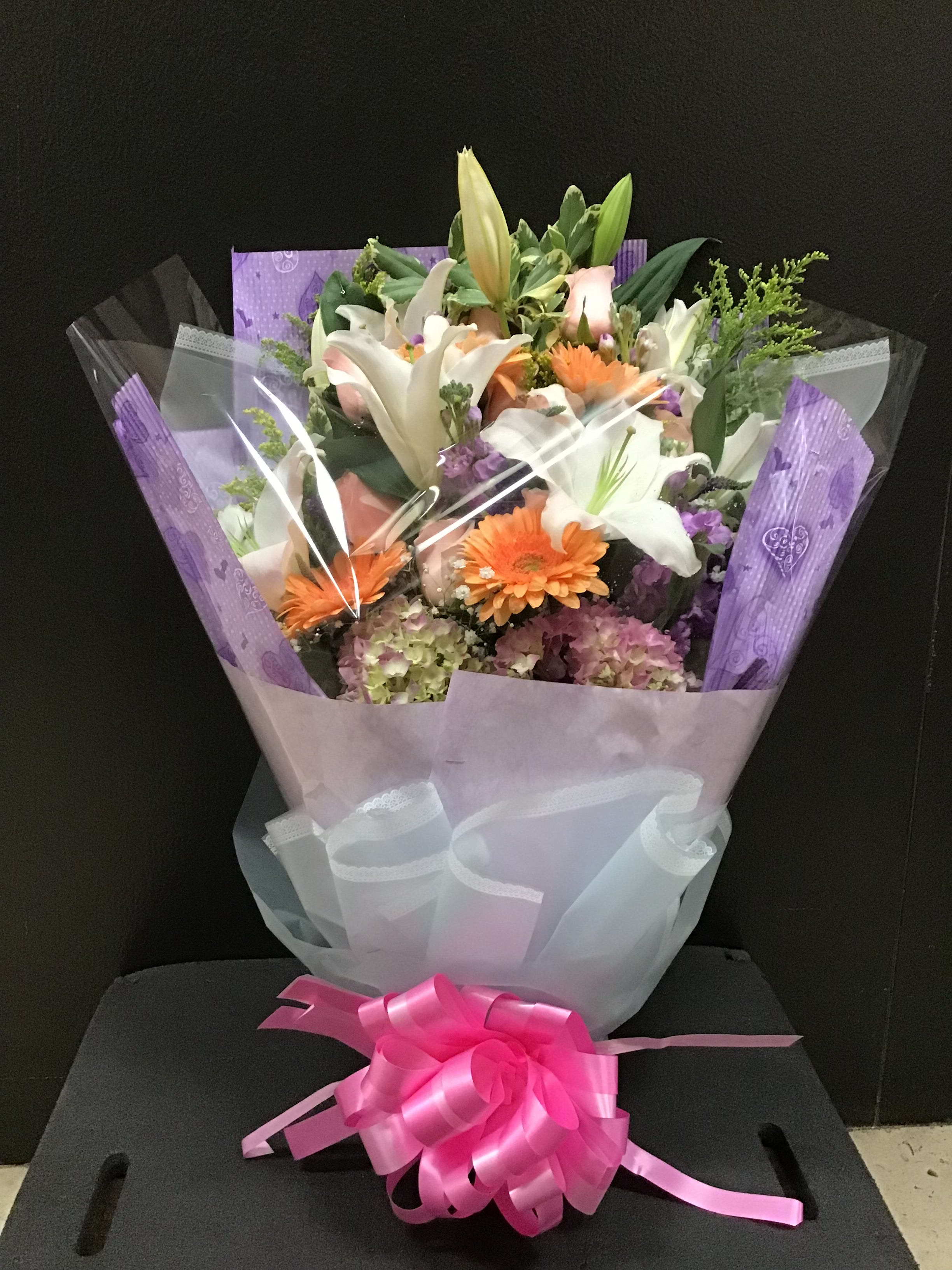 Hong Kong Style Warping (BQ26)  - This bouquet make white lilies, pink roses, peach gerbera daisy and hydrangea wrapping in a craft paper. 