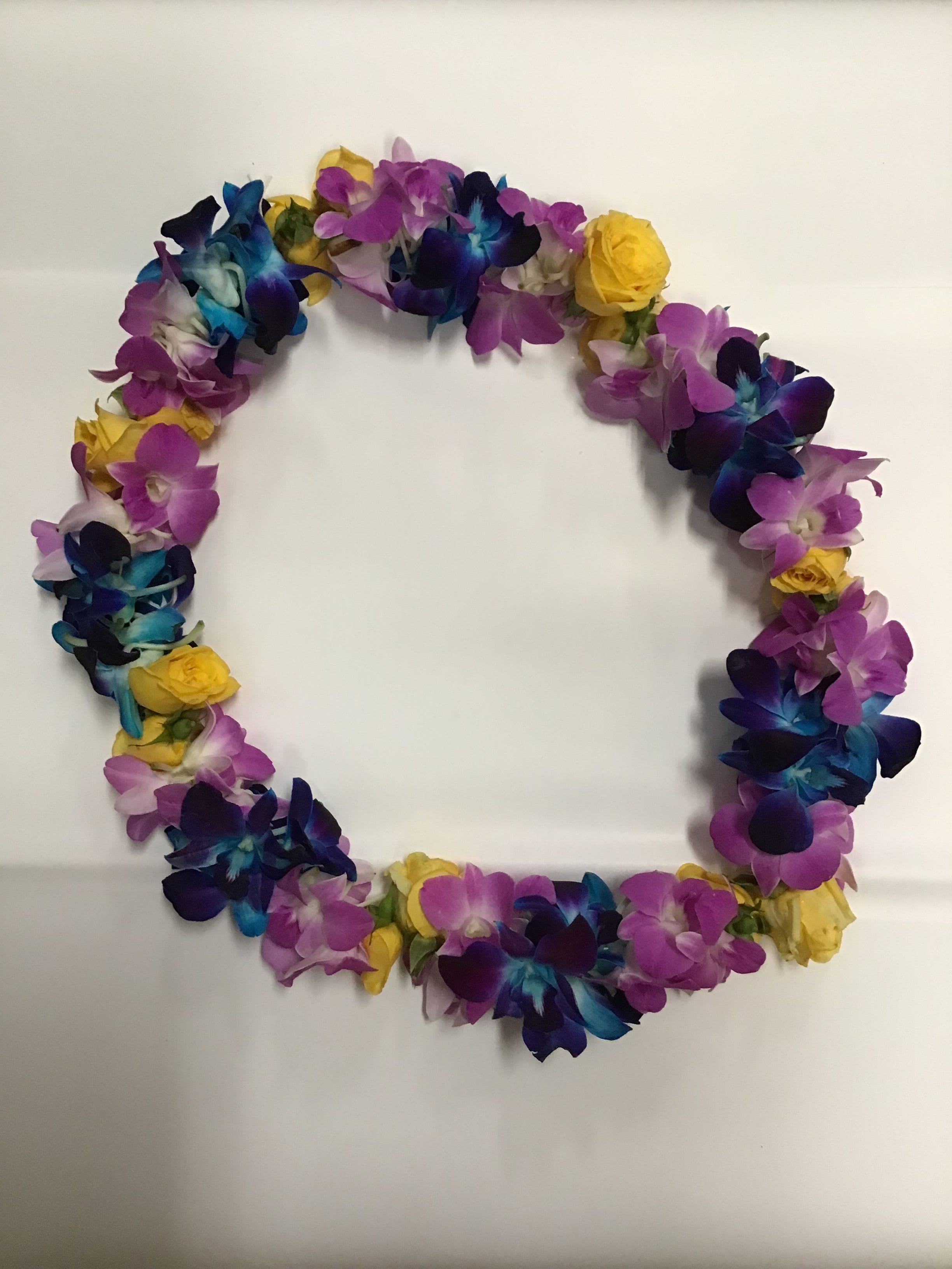 Lei 27 - This lei made with blue and Lavender dendrobium orchid and yellow spray roses