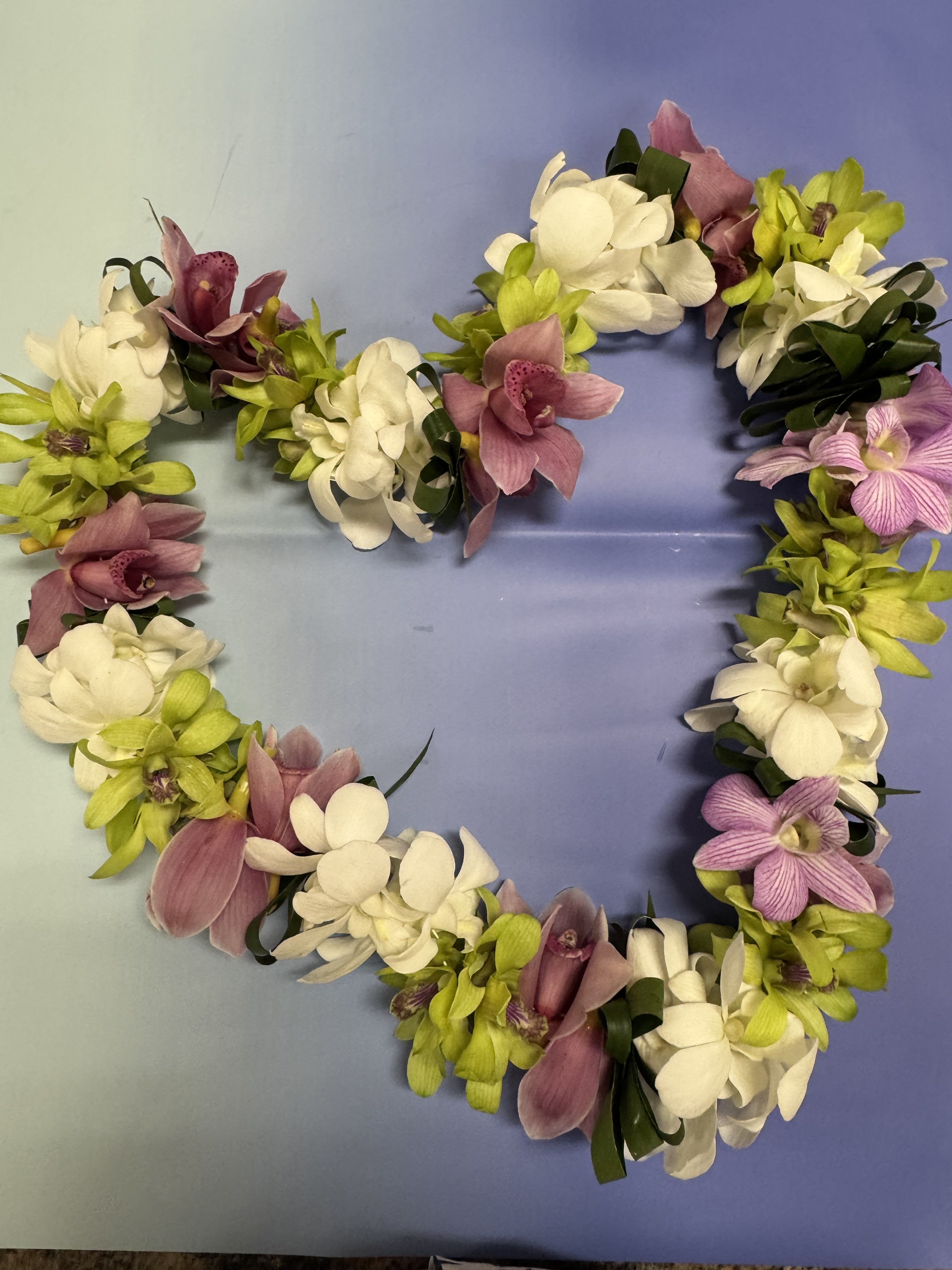 Lei 30 - This beautiful Graduation lei made with  denbrobium  orchids , cymbidium orchids and to leaf 