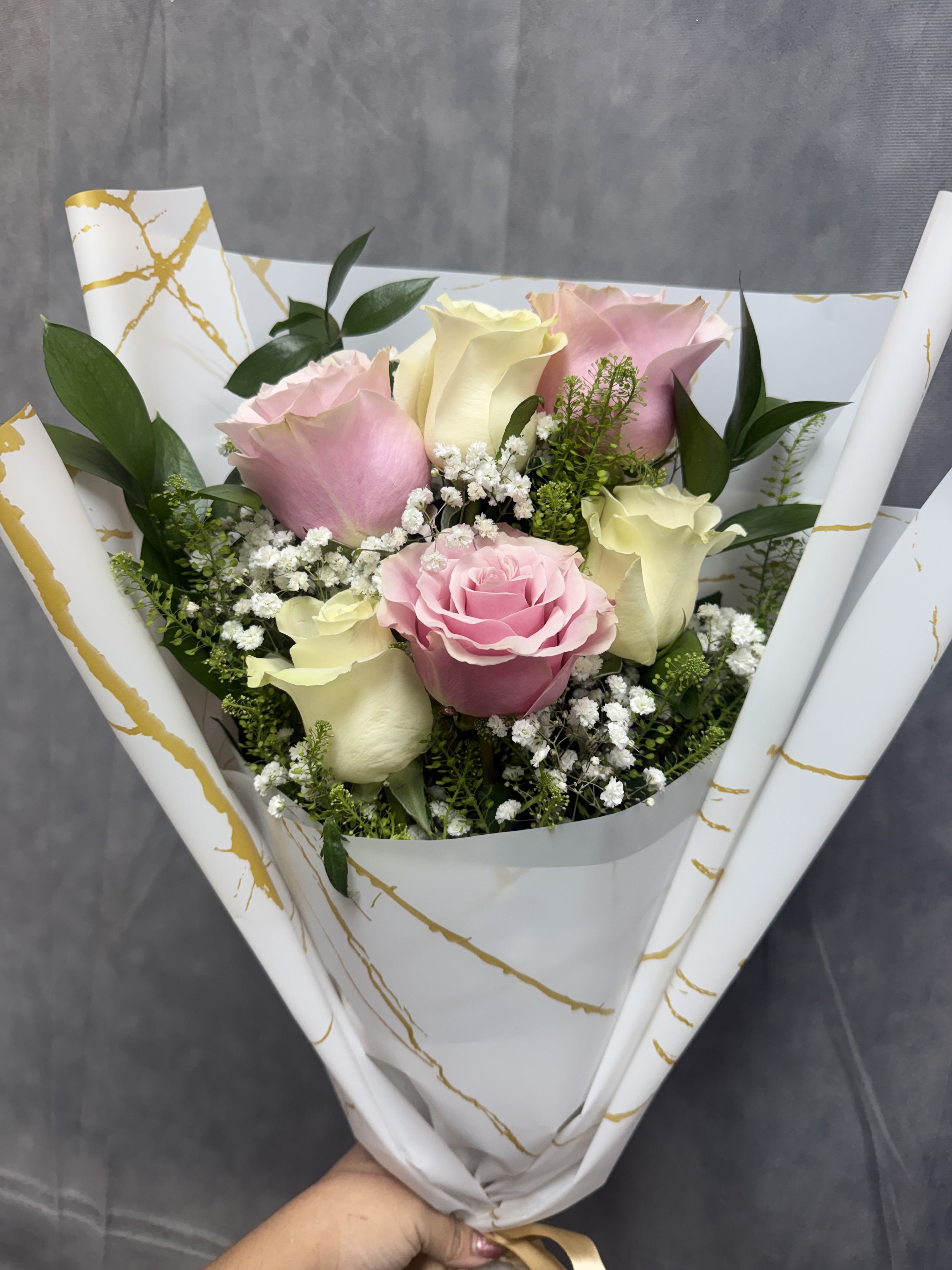 Pink and white layered bouquet  - Half dozen layered Pink and white roses with baby’s breath wrapped in elegance perfect for celebrating milestones 