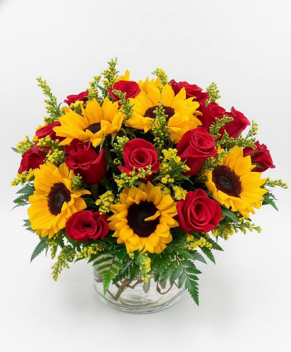 Brilliant Sunshine - Brilliant Sunshine is a radiant vase arrangement designed to brighten any space and lift every mood. Featuring bold sunflowers paired with classic red roses, accented by golden solidago and lush baker’s fern, this arrangement is a beautiful balance of warmth, romance, and natural elegance. Perfect for celebrations, thank-you moments, or just because, Brilliant Sunshine delivers a joyful pop of color and a confident bloom statement—just the way Party Chica Blooms does best. 