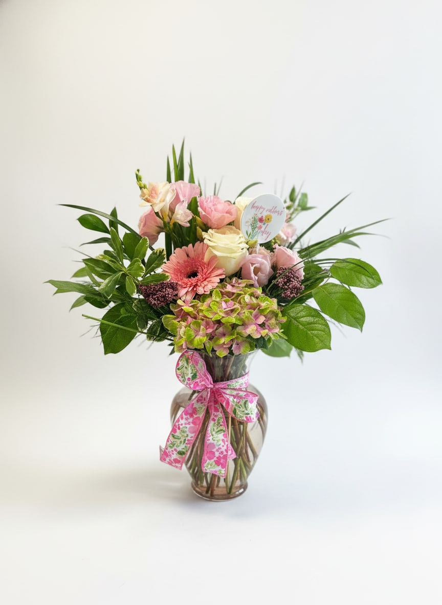 Mother's Joy - A full-color explosion, Mother's Joy is a beautiful gift for anybody you want to show love on Mother's Day. This arrangement is sure to bring joy to any Mom.  Approximate Dimensions: 14"D x 16"H