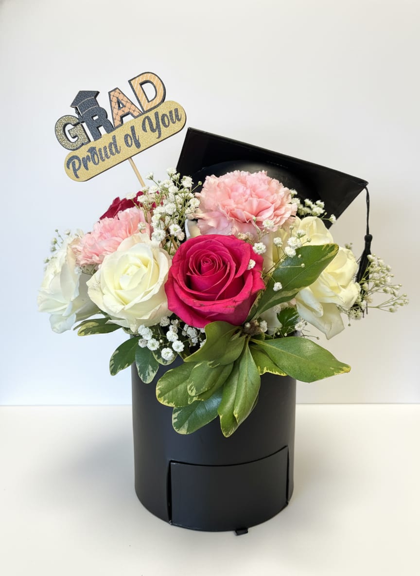 The Graduate - Celebrate your graduate with a lovely arrangement set to signify a worthy accomplishment.