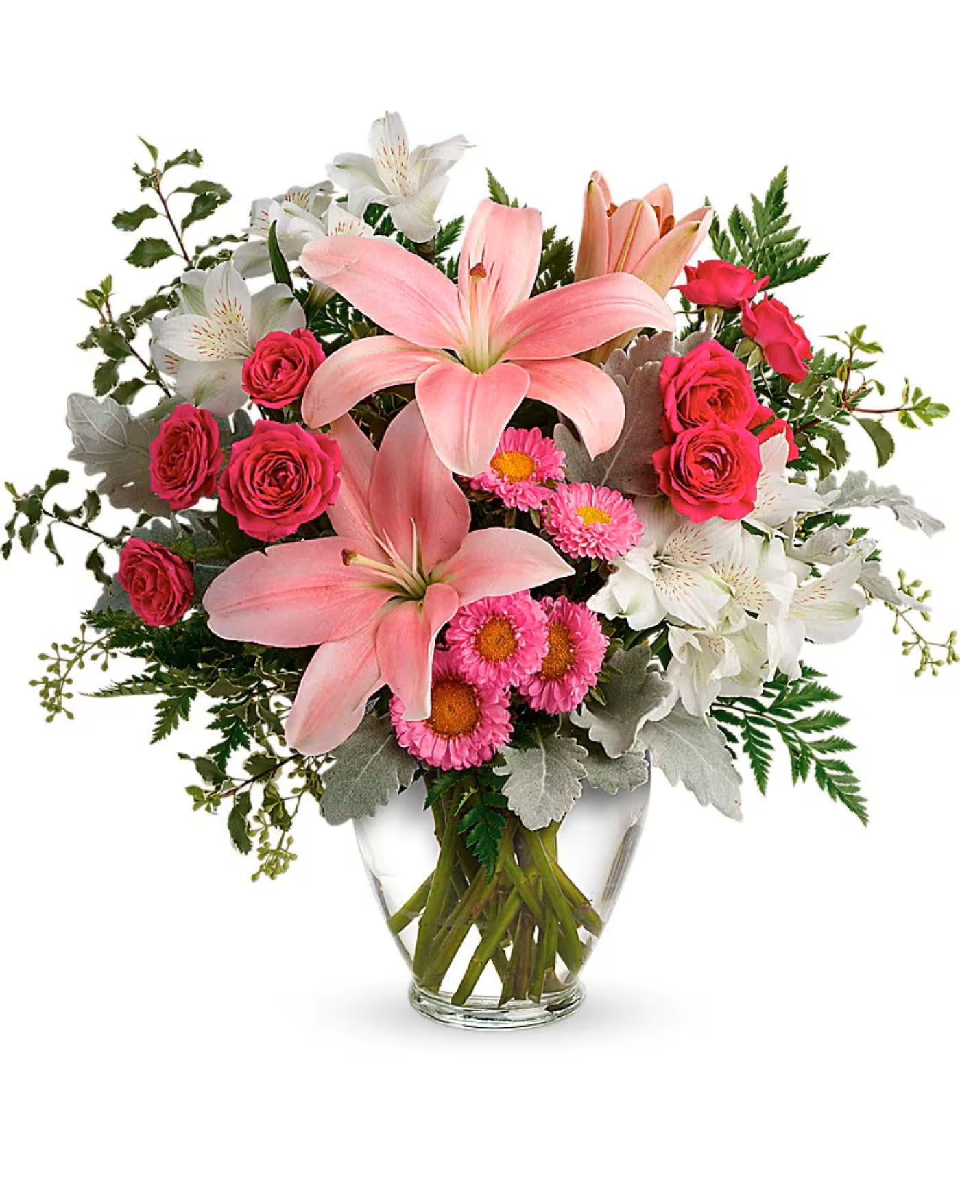 Blush Rush Bouquet  -  Luxe lilies in a beautifully blushing shade of pink are sure to make them smile, no matter the occasion!  This pretty bouquet features one dozen hot pink roses, pink lilies, white alstroemeria, pink gerberas leatherleaf fern and greeneries. Delivered in a Serenity Vase.  Picture is Deluxe.  Complimentary golden card with envelope included, please send your card message with the order.
