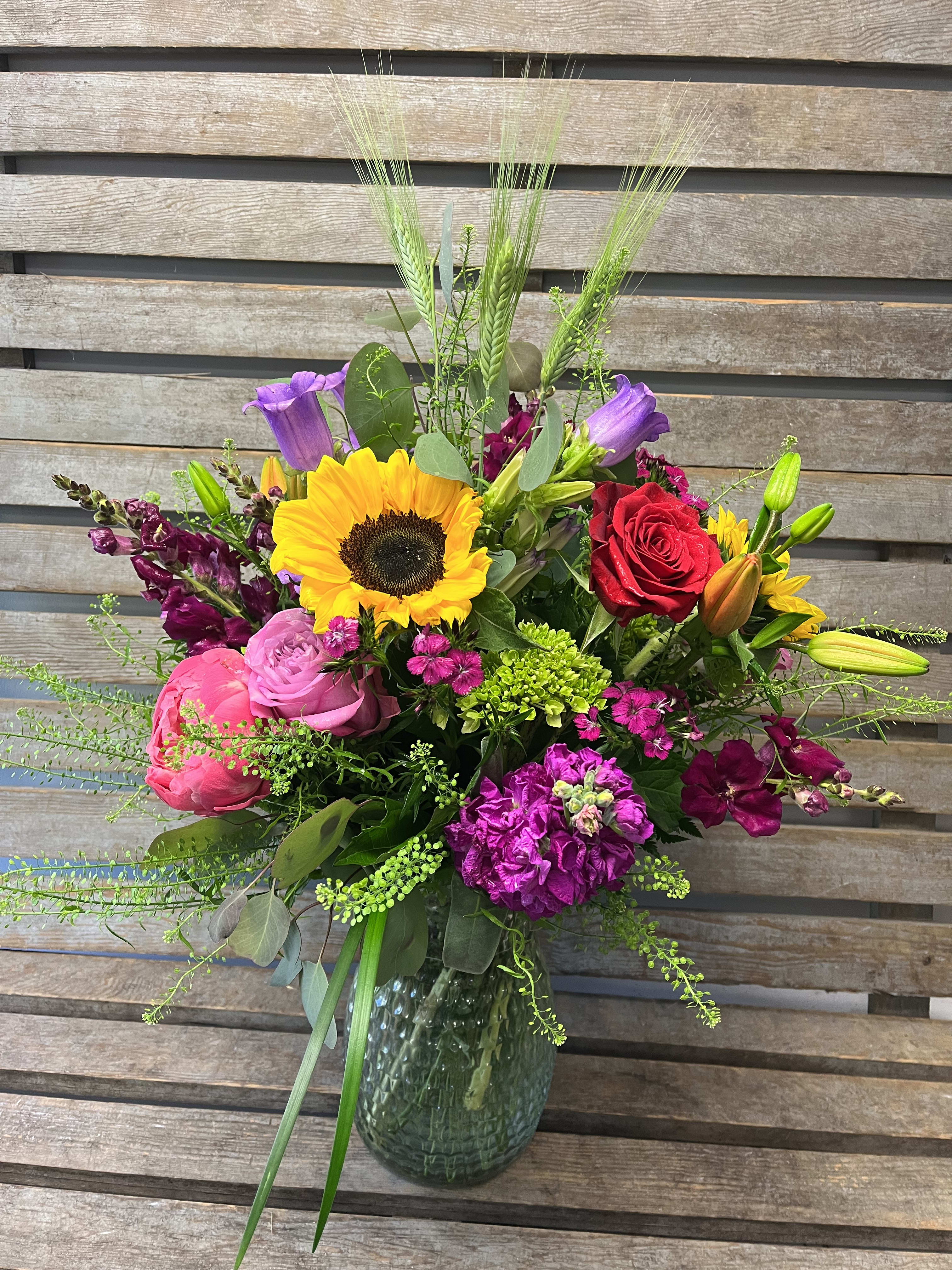 Large local  vase.  - Large designers choice of local grown  flowers. Each vase and flower selection is different every week. Lots of color! 