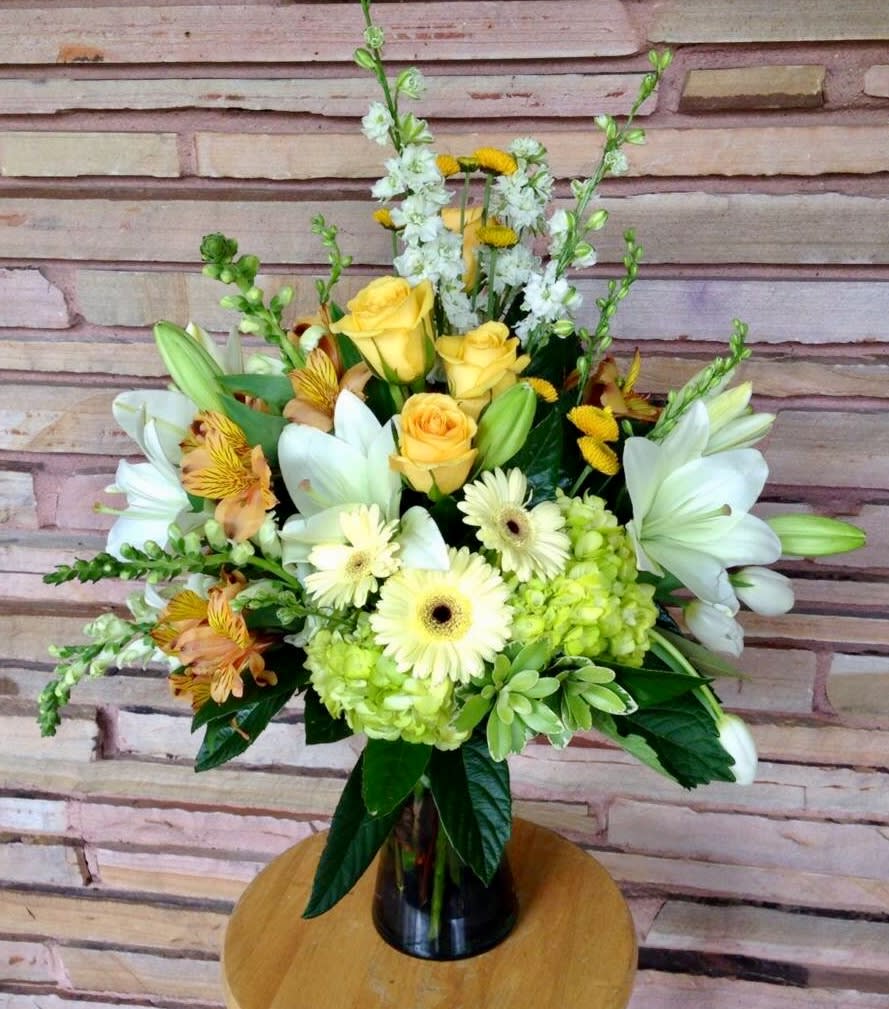 They call me Mellow Yellow - Yellow gerbs, green hydrangea, lilies, alstro, delphinium, snap dragons, tulips, roses, buttons