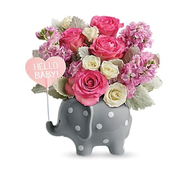 Pink and white flower arrangement in a gray elephant vase with a "Hello Baby!" sign