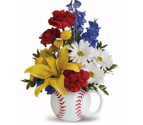 Father's Day Baseball Bouquet - Bright yellow asiatic lilies, blue delphinium, red carnations, white daisy spray chrysanthemums, yellow button spray chrysanthemums and a touch of myrtle are arranged in this oversized baseball mug.
