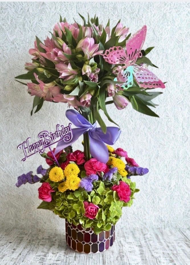 Butterfly Wishes Topiary  - This is a beautiful vibrant tiered topiary arrangement with alstroemerias on top and a colorful mix of flowers nestled in hydrangeas perfect for birthday or any other occasion. 