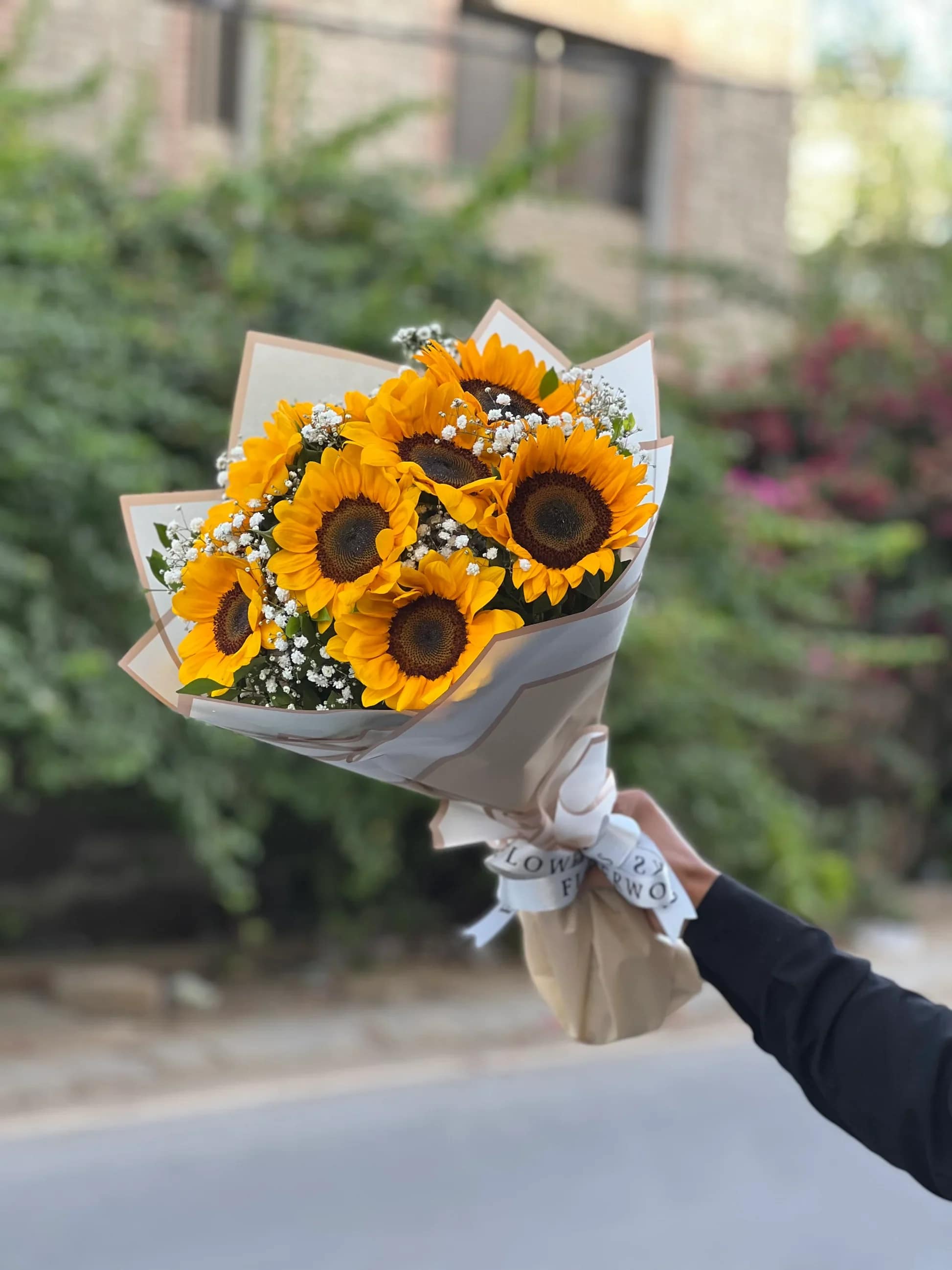 A Vibrant Bouquet of Stunning Sunflowers - The bouquet captures the dynamic energy sunflowers bring to any space. Their presence invites a burst of positivity and joy. Sunflowers Wrap (10) count. Customizable.