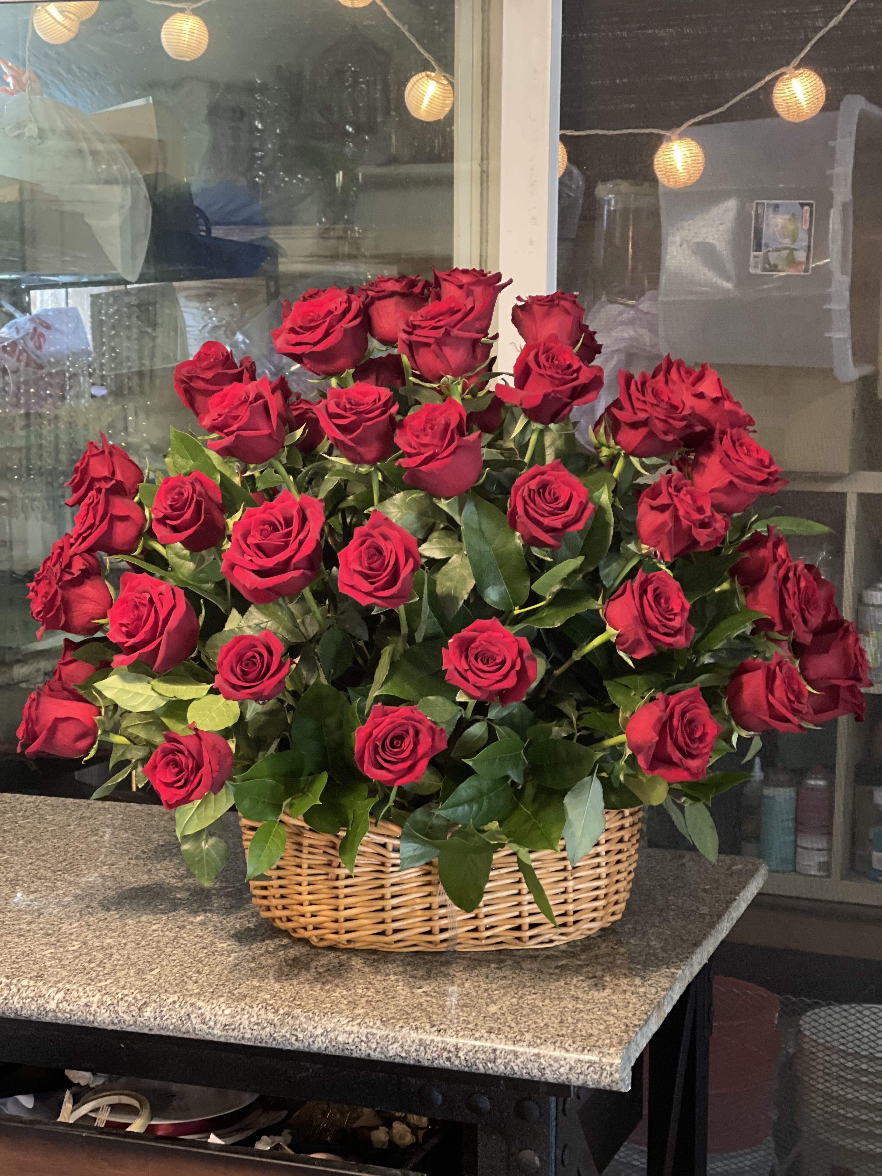 Long stem red roses in basket - We work with the most beautiful and fresh roses.  Beautiful arrangement perfect to impress and make someone smile. 