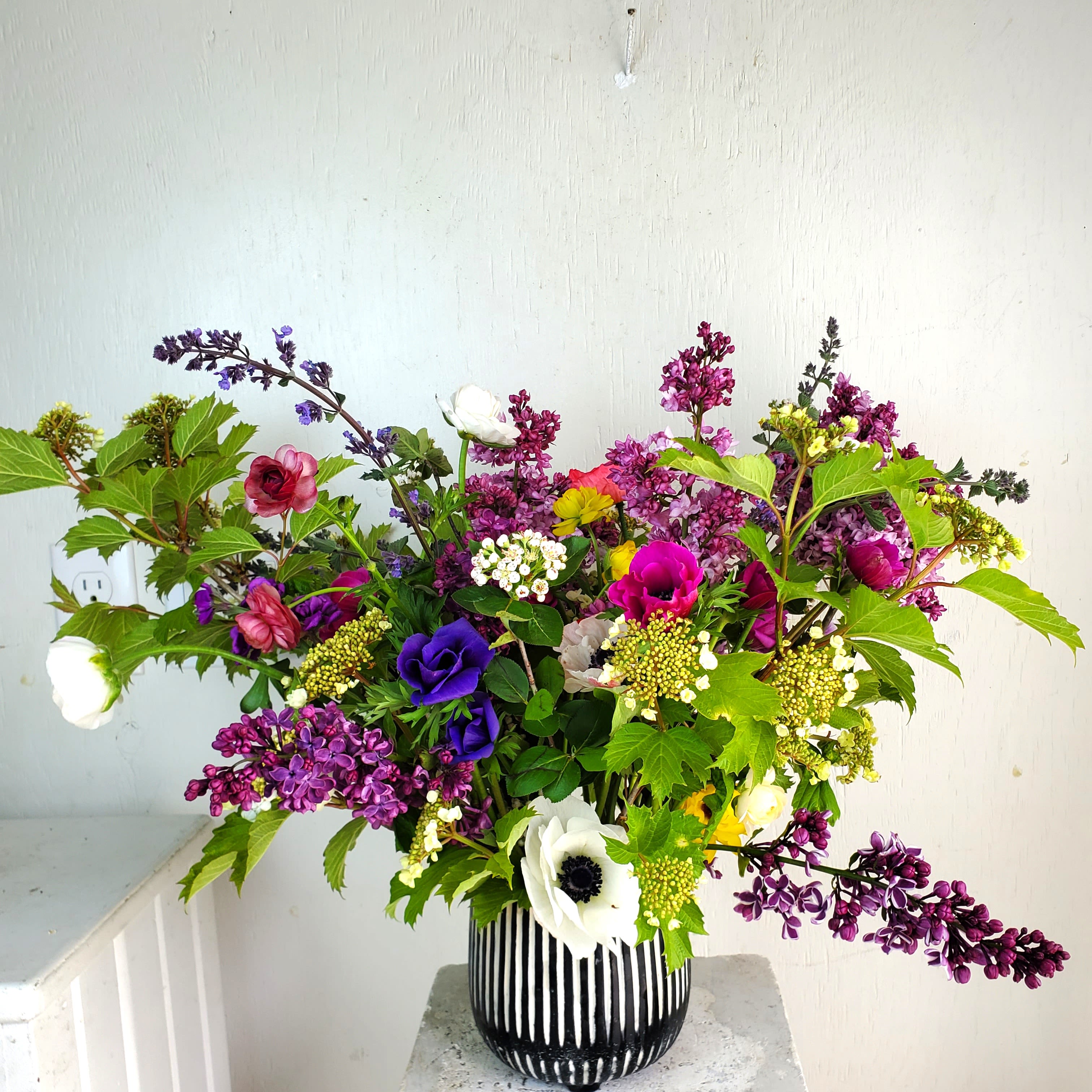 Colorful Wildflower (Growers Choice) - We are a small studio florist in a small town. Every bouquet we create is a one-of-a-kind creation available. The photos do not represent the exact flowers that will be delivered. They are intended to provide you with an idea of  the variance that can be expected.  The season, availability of flowers,interpretation, and the current materials available. 