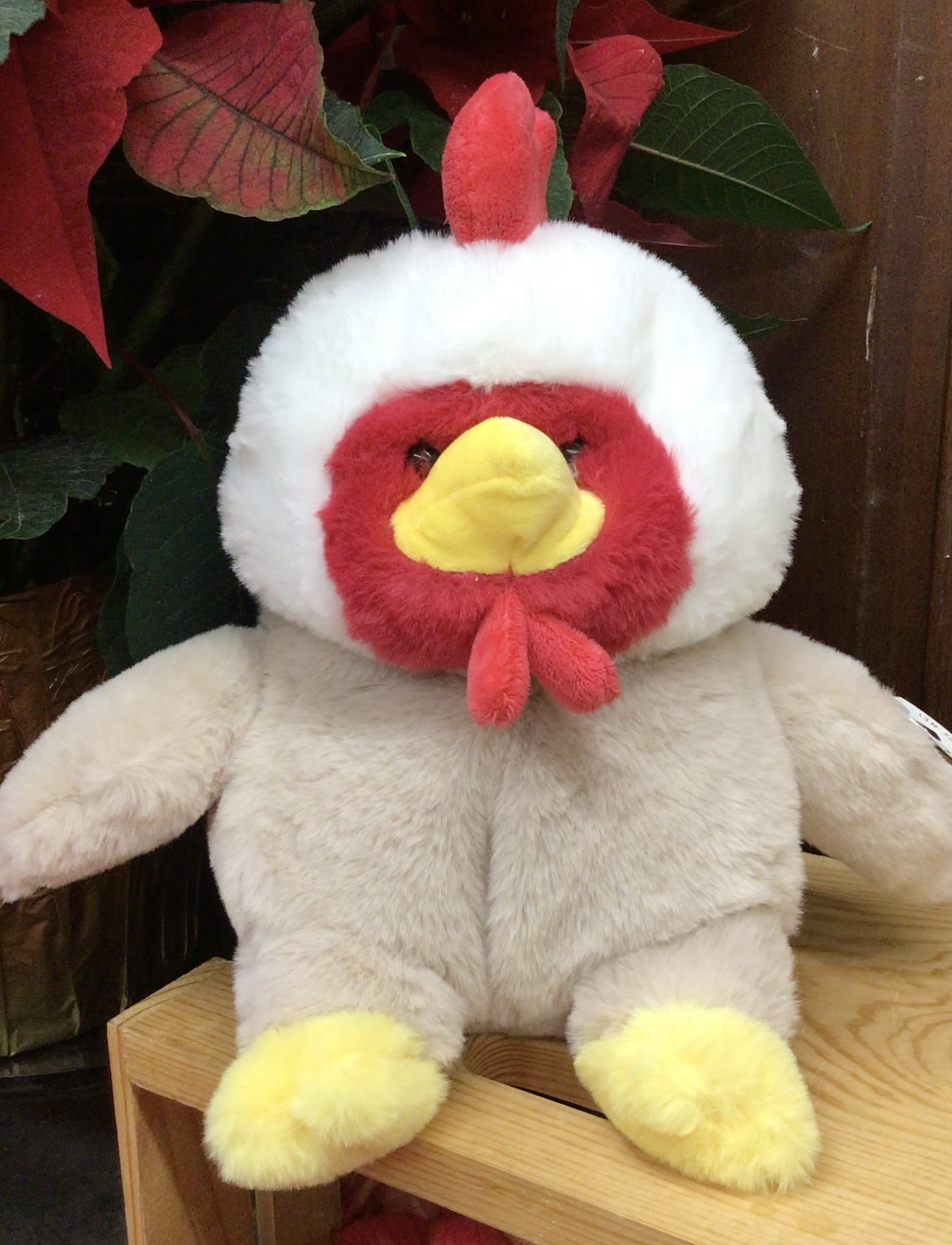 Plush chicken toy with red, white, and yellow features