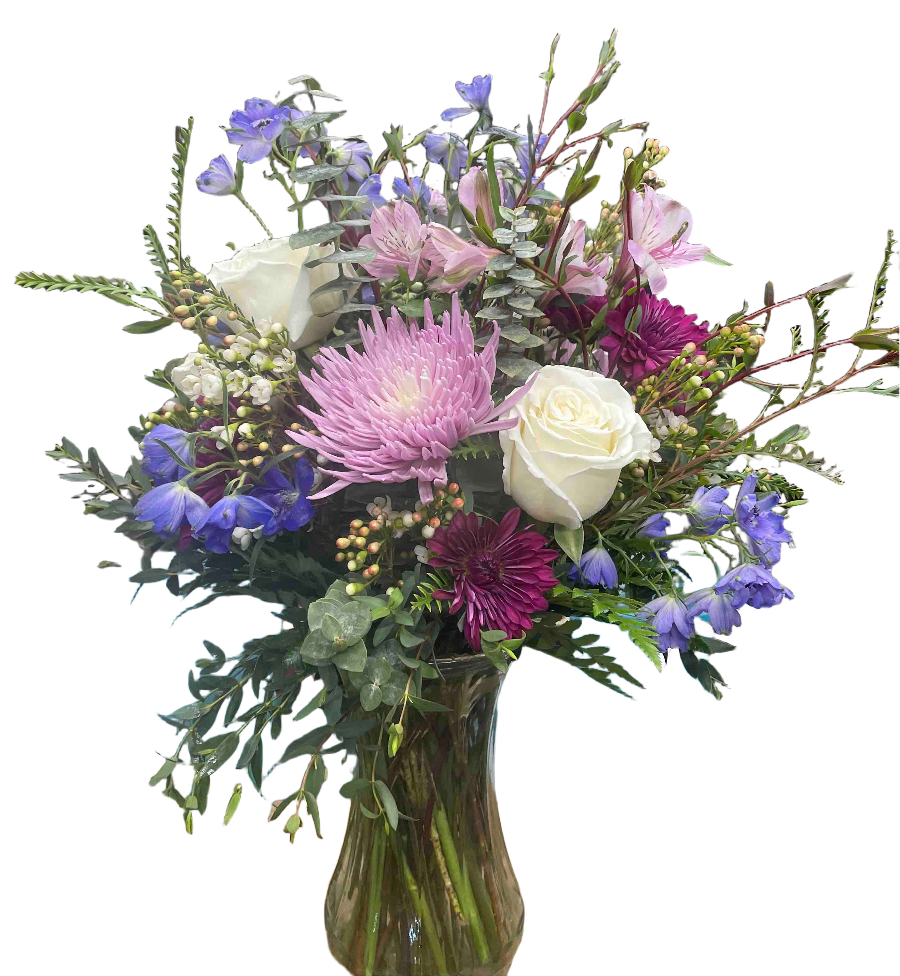 Blue Harmony Bouquet - This romantic loose style mix of white roses, blue delphinium, purple chrysanthemums in a glass vase is sure to sweet anyone off their feet.