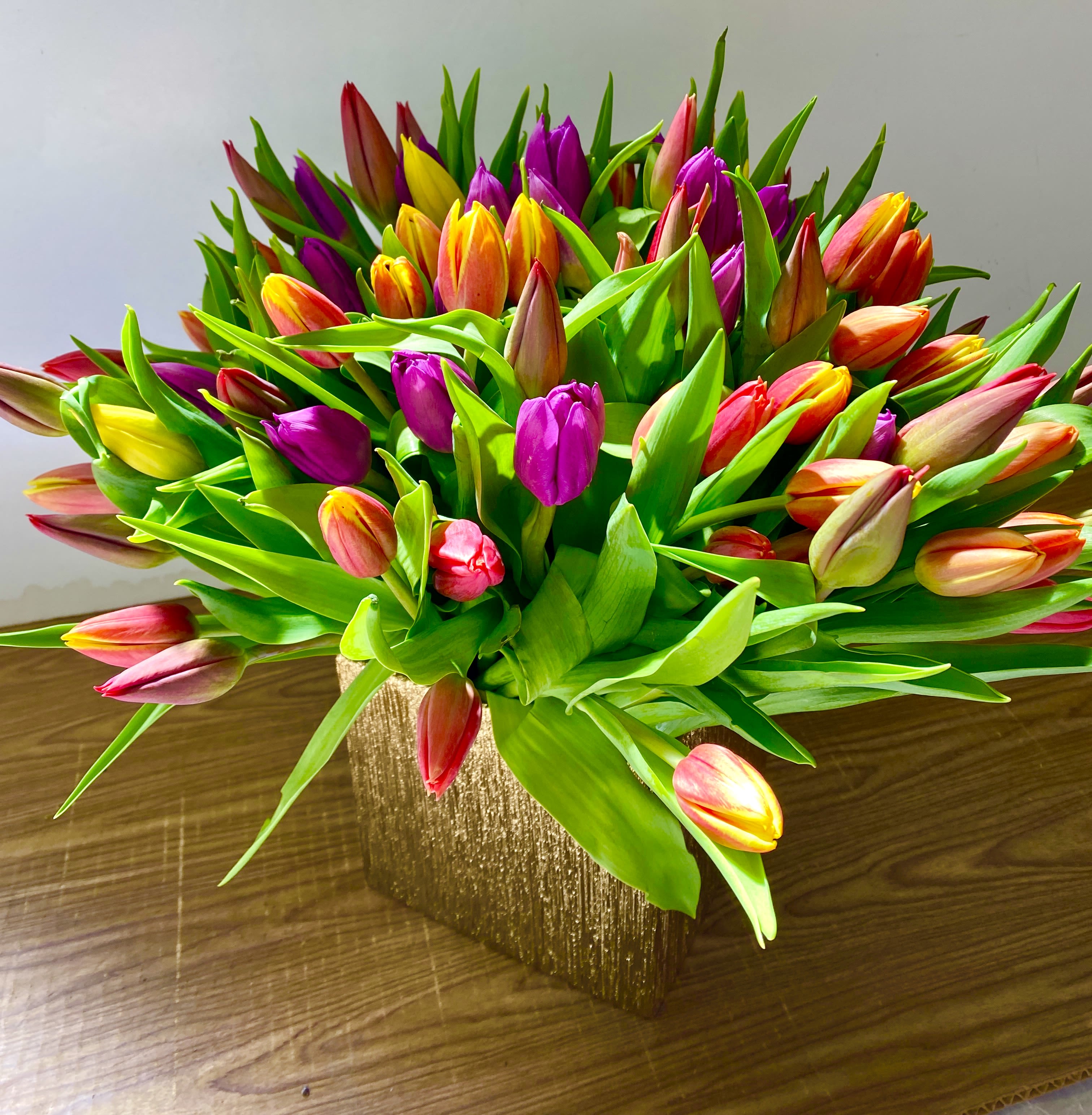 BLIND DATE - 100 stems of different colors of tulips in a beautiful pink ceramics vase