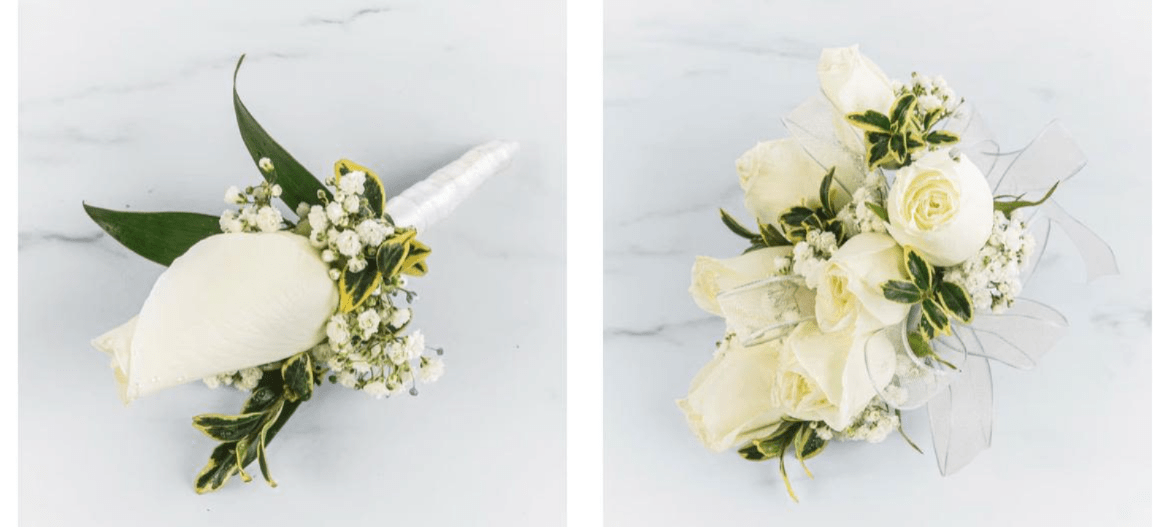 CORSAGE AND BOUTONNIERE - Elegant white rose prom corsage and boutonnière set designed with fresh roses, baby’s breath, and delicate greenery accents. This timeless floral combination adds a classy and romantic touch to any prom look. Handcrafted with soft white ribbon details, it’s perfect for creating unforgettable prom memories with an elegant and sophisticated style.