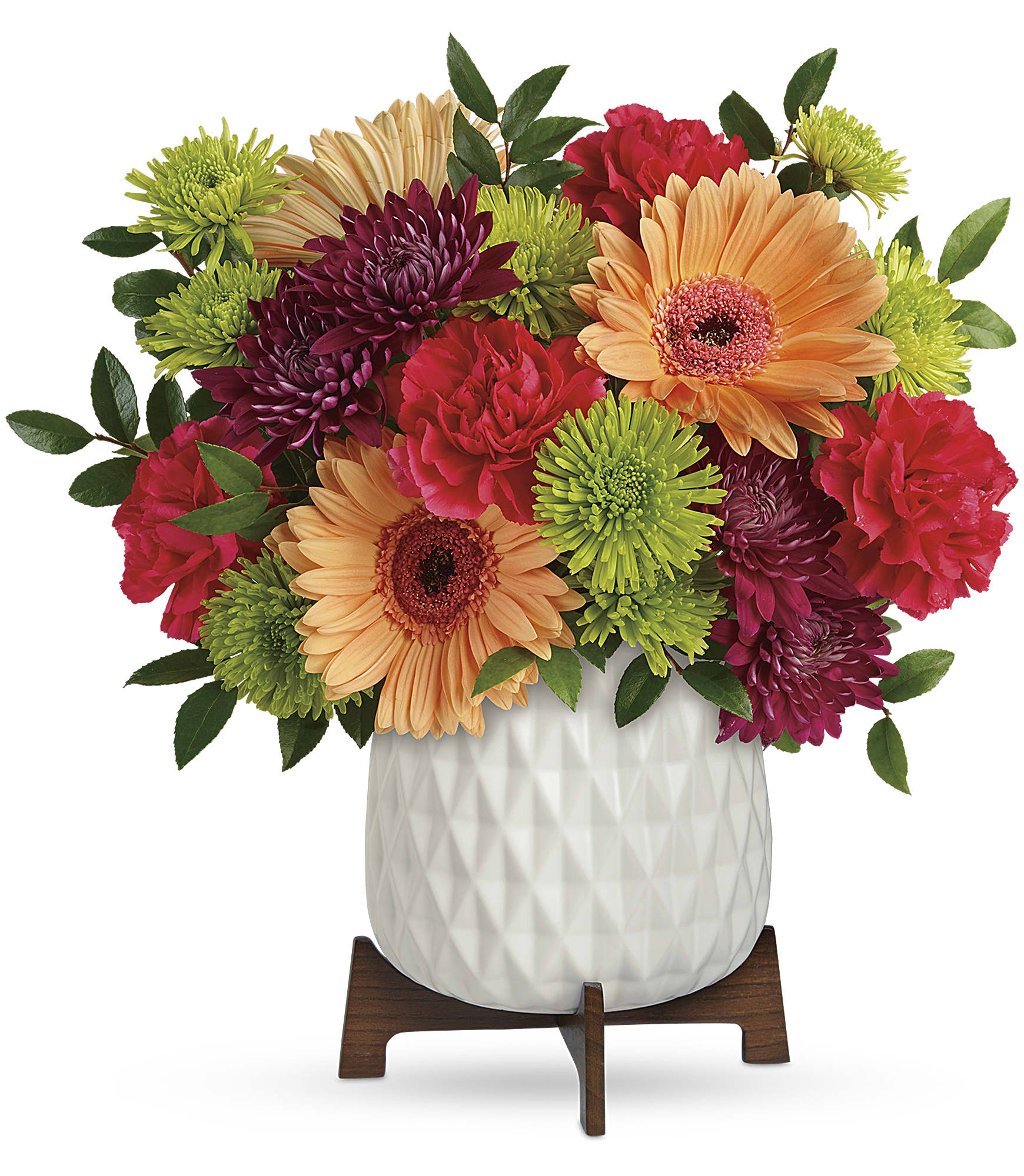 Mid Mod Brights Bouquet - Two gorgeous gifts in one! Celebrate any occasion with this bouquet of bright blooms, stylishly presented in a mod mid-century ceramic planter keepsake!   This bright bouquet features hot pink roses, peach gerberas, hot pink carnations, green cushion spray chrysanthemums, purple cushion spray chrysanthemums, and huckleberry. Delivered in a Mid Mod Geometric Planter. Approximately 13 1/2" W x 13 3/4" H  