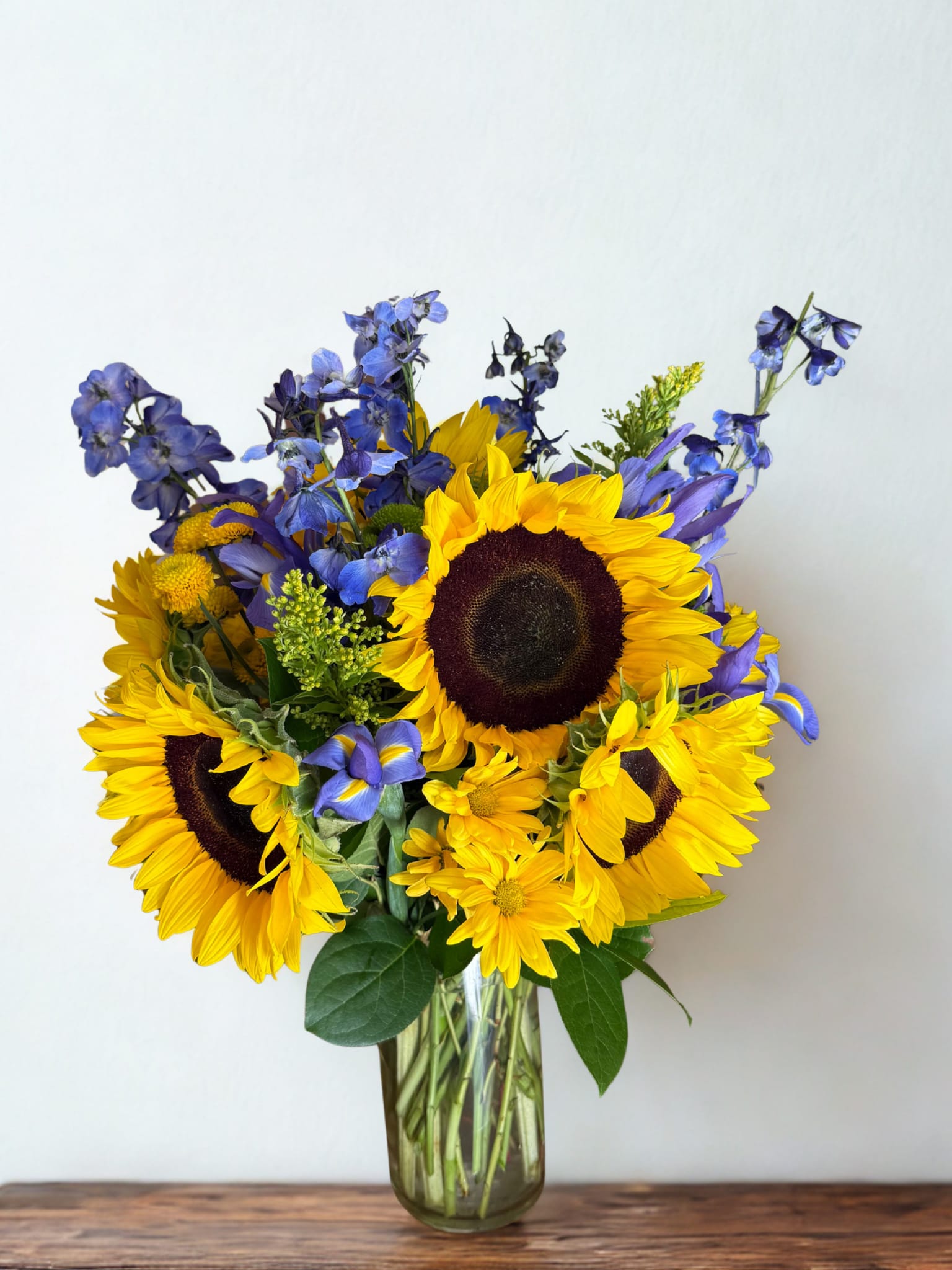 Sunshine bouquet Flowers - arrangement in a vase with sunflowers, delphiniums, daisies, pom pon, filler in a vase 