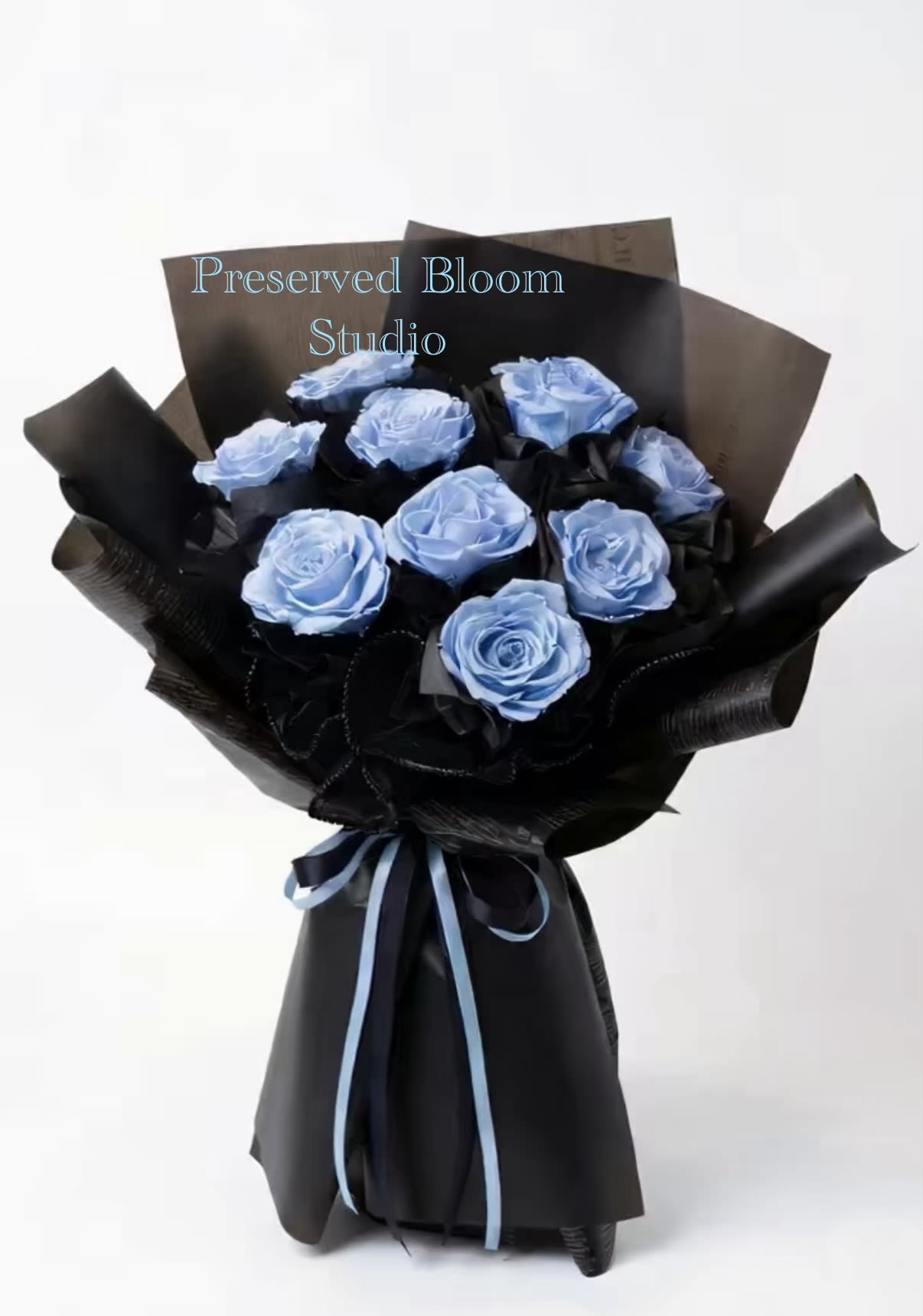 Bouquet of light blue roses wrapped in black paper with a blue ribbon