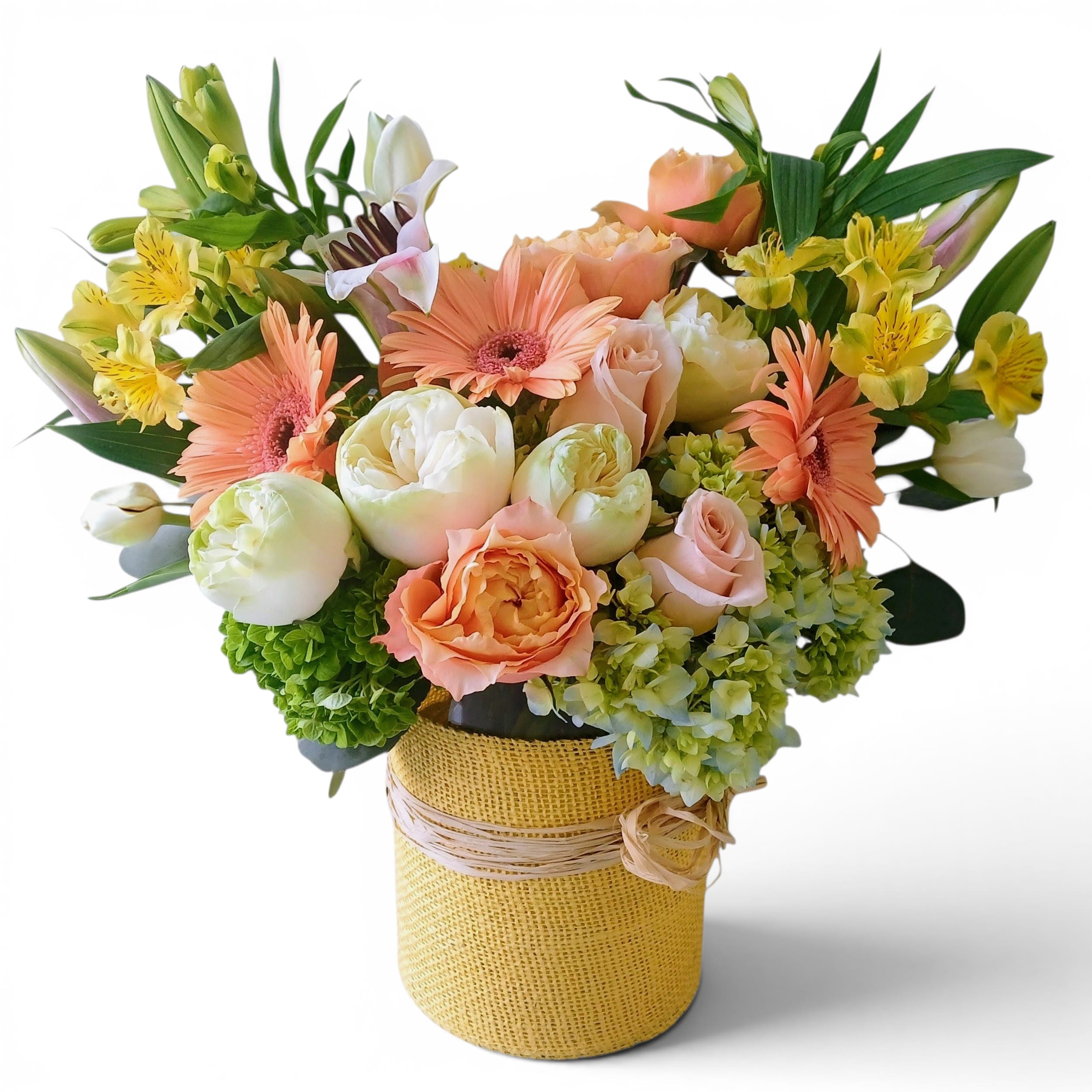 Peach and white mixed bouquet in a burlap-wrapped vase
