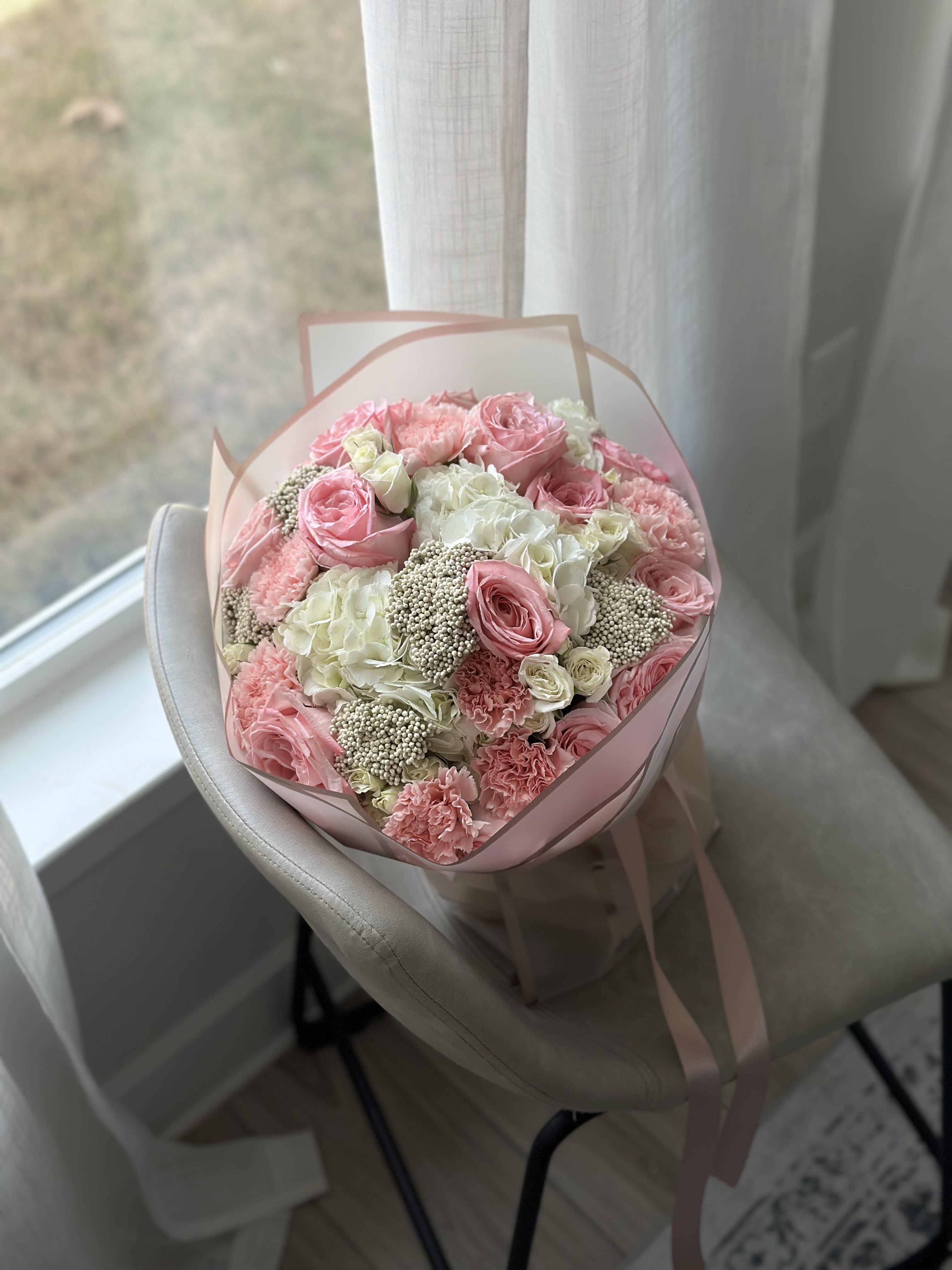 Rosée du Matin - A graceful bouquet blending soft pink roses, creamy hydrangeas, and delicate filler blooms in romantic tones. Rosée du Matin captures the freshness of a dewy morning and the elegance of natural beauty. A perfect choice for gentle celebrations and heartfelt moments. 
