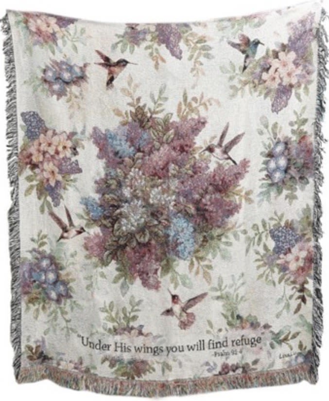 Whisper Wings Tapestry Throw - Wrap your loved ones in comfort, faith, and remembrance with our Whisper Wings Memorial Throw. This beautifully woven sympathy blanket features soft florals, delicate hummingbirds, and the comforting scripture verse, “Under His wings you will find refuge” from Psalm 91:4. Designed to create a peaceful tribute, this memorial throw is a meaningful choice for funeral services, celebrations of life, church memorials, visitation services, sympathy gifts, and remembrance displays.  The Standard version is delivered folded neatly and tied with a coordinating ribbon for a thoughtful keepsake families can cherish long after the service.  Our Deluxe presentation features the Whisper Wings throw displayed on a customized leased easel with matching ribbon, creating an elegant focal point for funeral homes, churches, memorial services, and celebration of life gatherings.  The Premium version includes the memorial throw displayed on a customized leased stand accented with a fresh floral spray and coordinating ribbon for a softer, elevated presentation. Fresh flowers may vary seasonally while maintaining the overall style shown.  Available for funeral homes, churches, and memorial services throughout Greensburg, Batesville, Shelbyville, Rushville, North Vernon, Hope, Sunman, Westport, and surrounding Southeast Indiana communities.