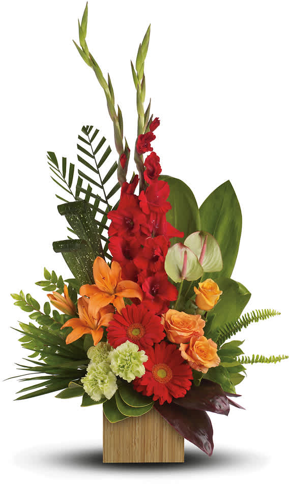Tropical flower arrangement with red, orange, and green blooms in a wooden container